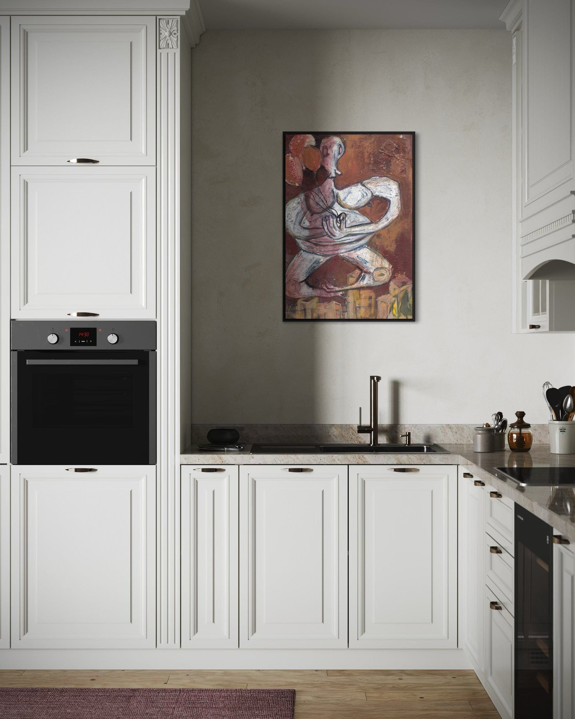 Modern kitchen with white cabinets, black appliances, and a wall art piece.