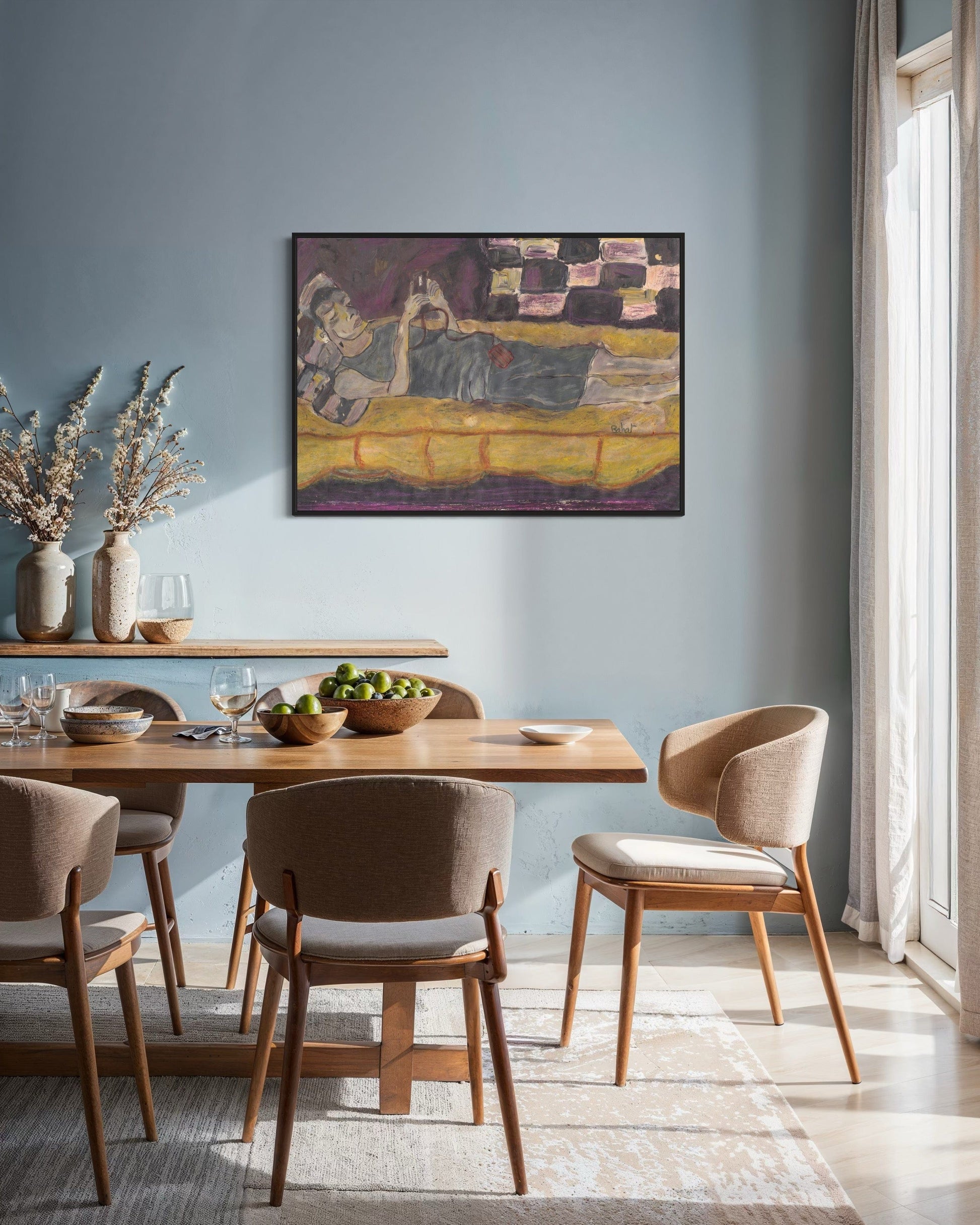 Dining room with wooden table and chairs, light blue walls, and a painting on the wall.