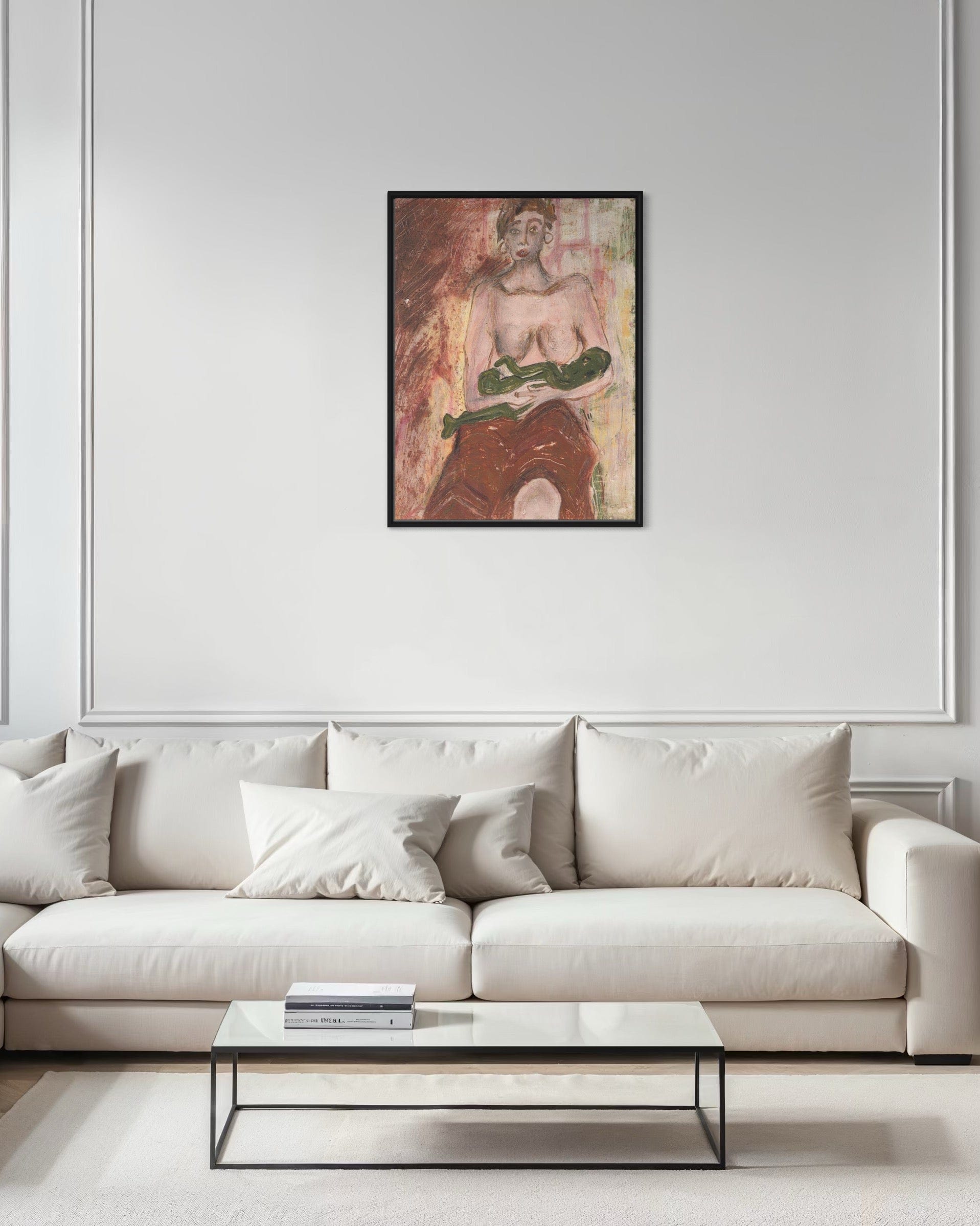 Modern living room with a white sofa, coffee table, and framed artwork on the wall.