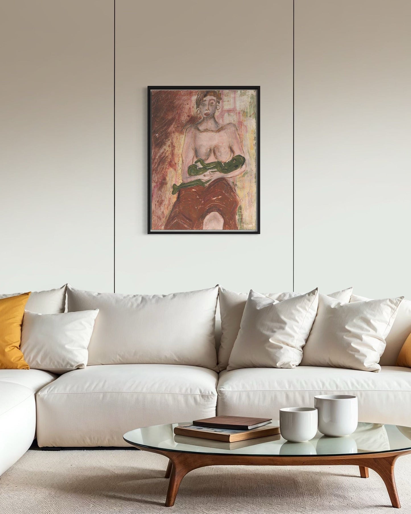 Modern living room with a white sofa, coffee table, and framed artwork on the wall.