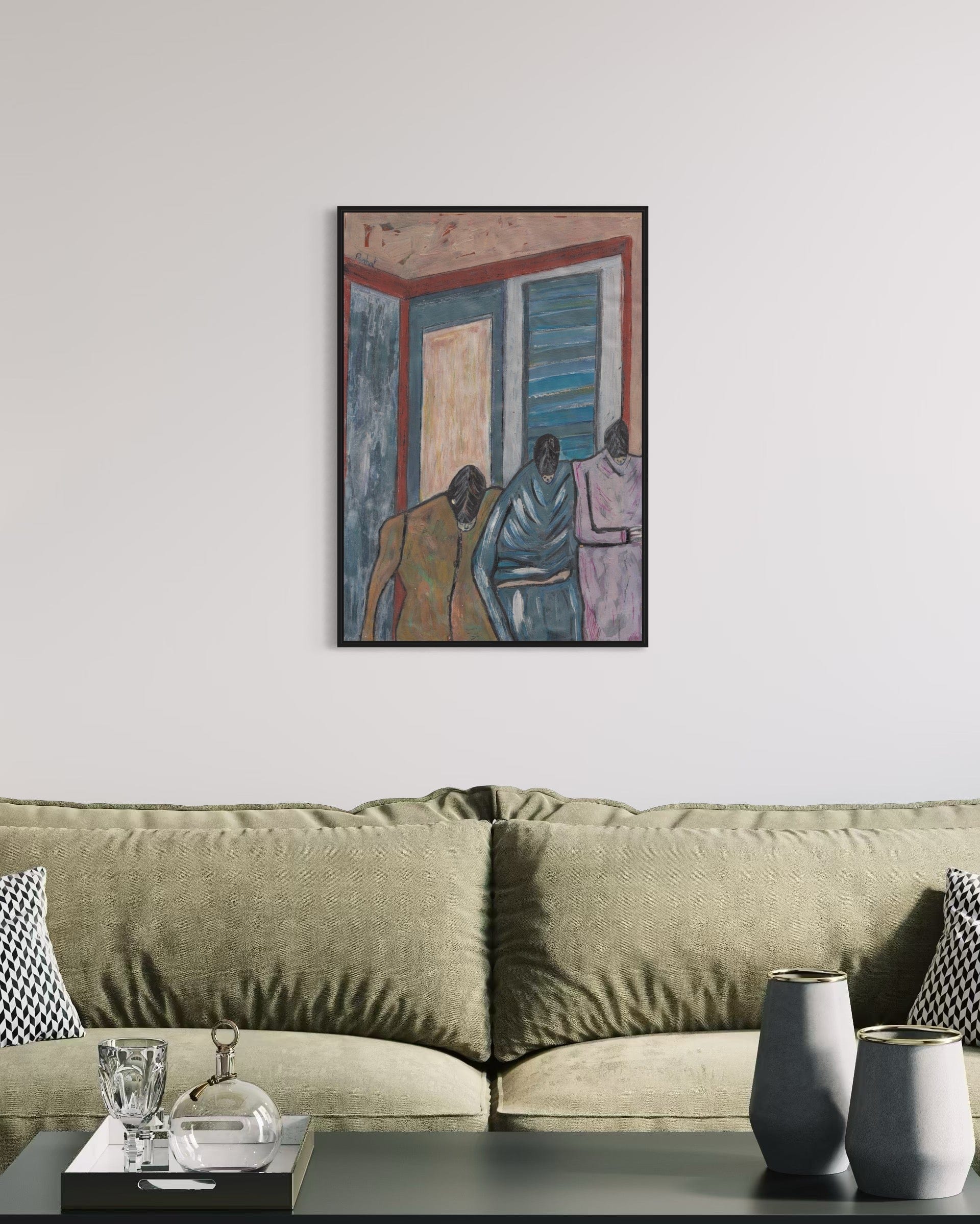 Framed artwork above a sofa in a living room