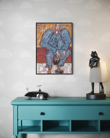 Framed artwork above a teal console table with decorative items.
