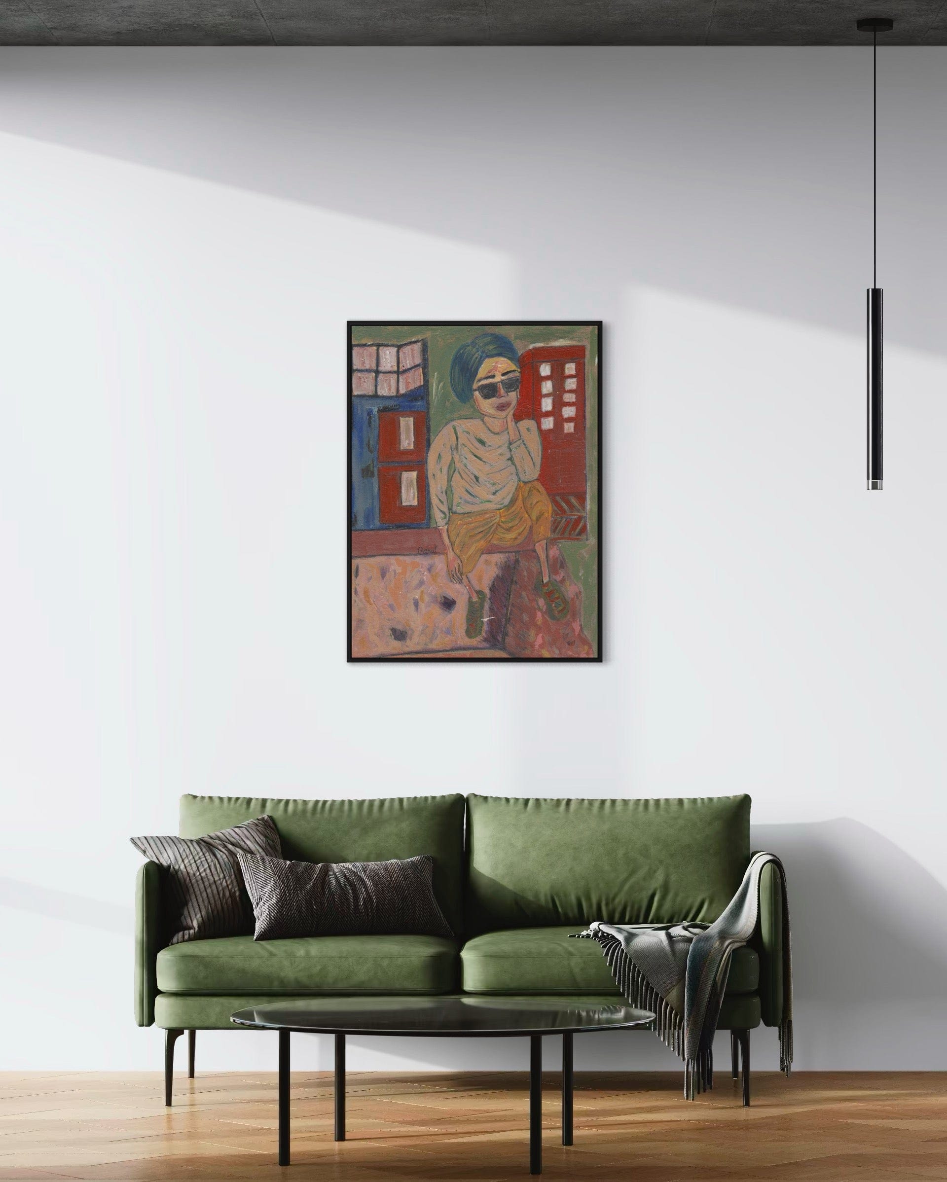 Green sofa in a living room with a colorful abstract painting on the wall.