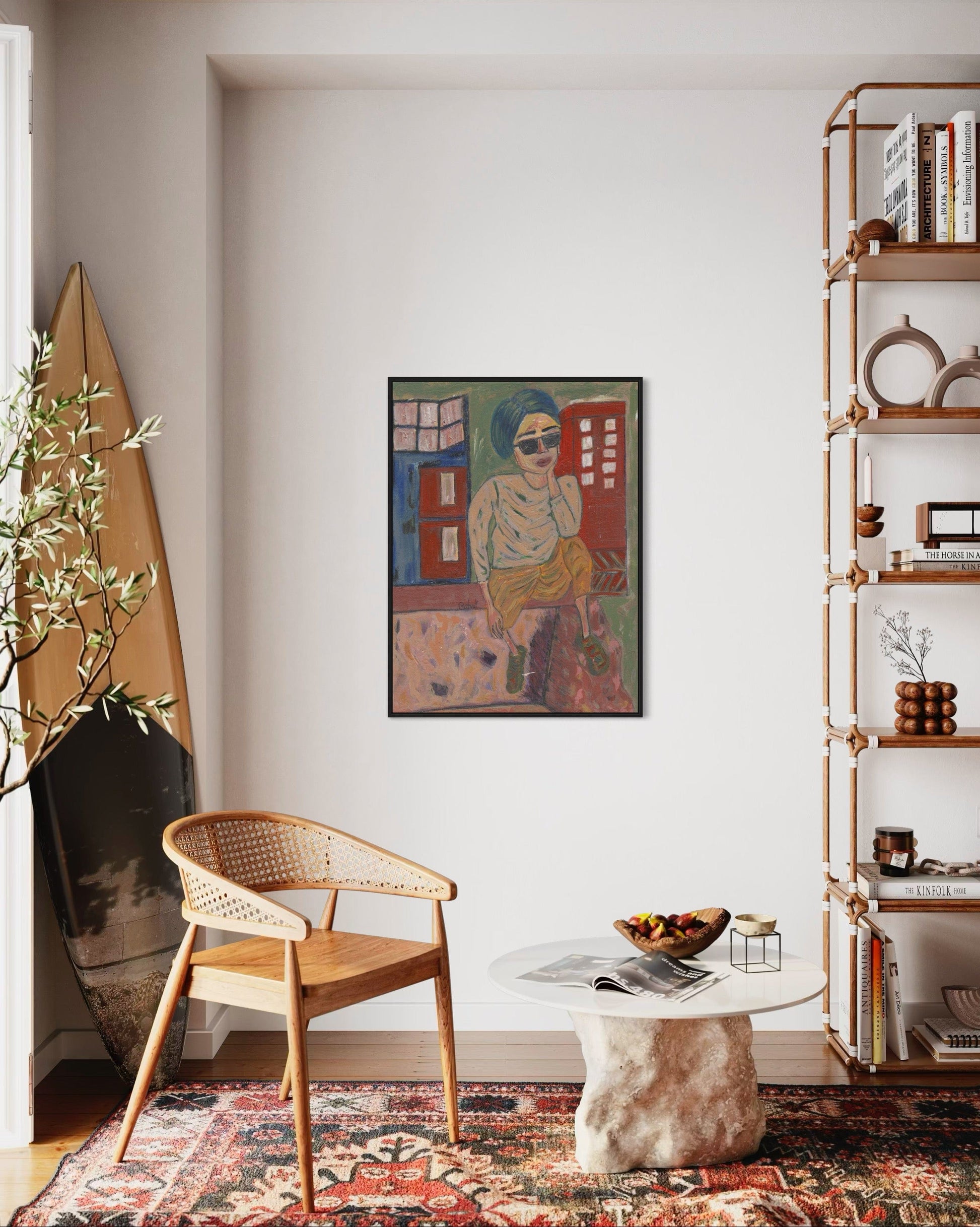 Living room with a wicker chair, round table, and bookshelf.