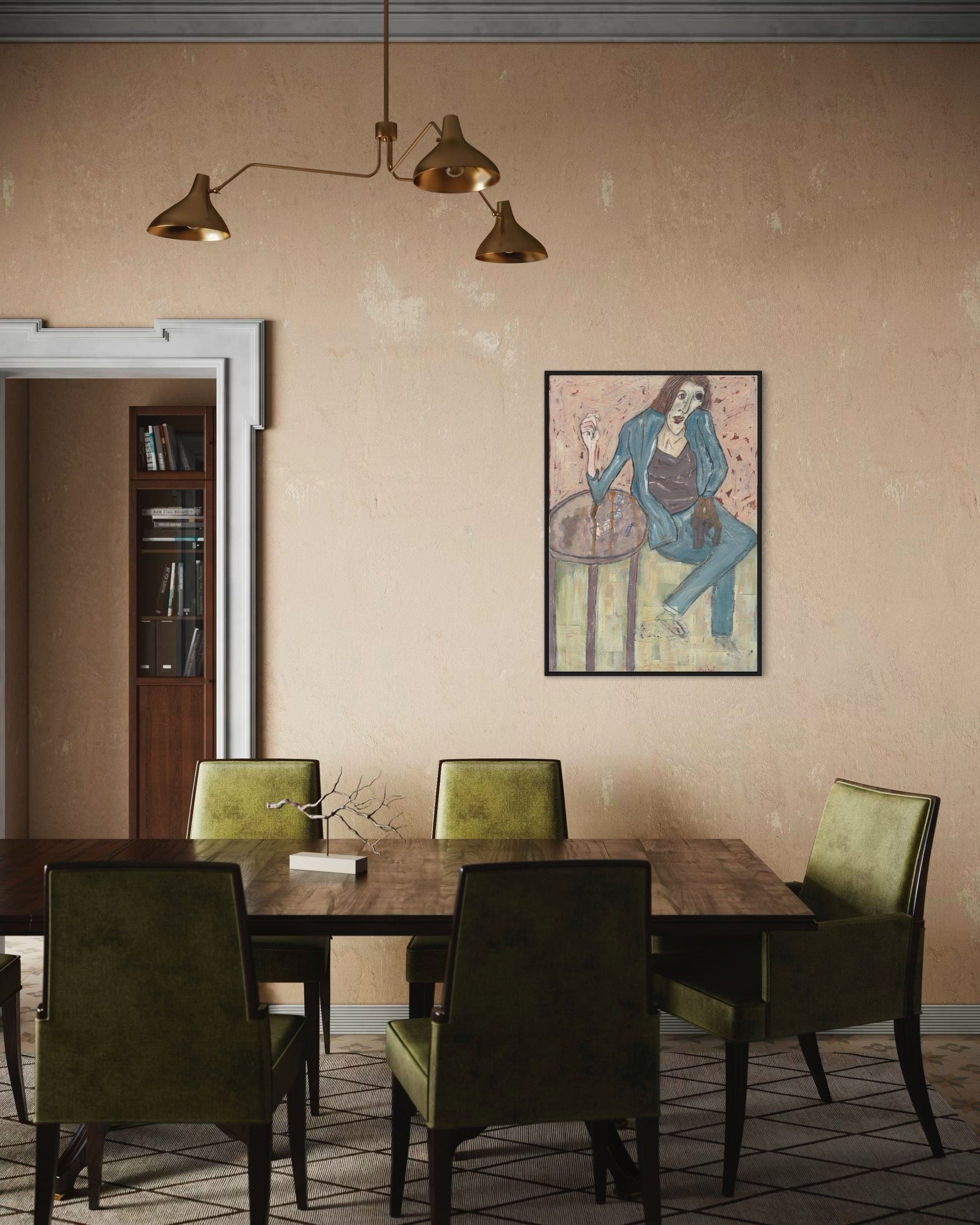 Dining room with wooden table and green chairs, framed artwork on the wall.