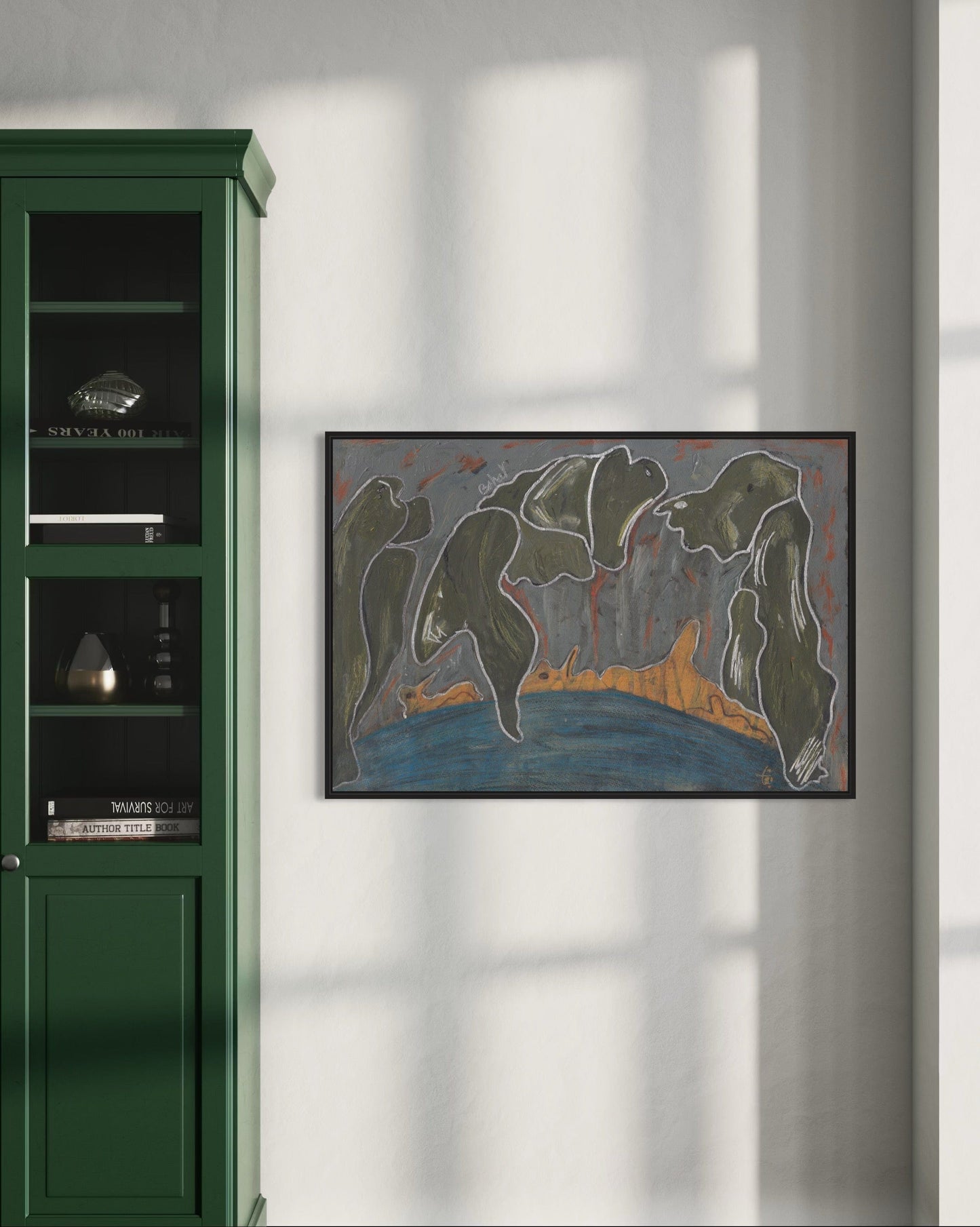 Framed abstract painting on a wall next to a green cabinet