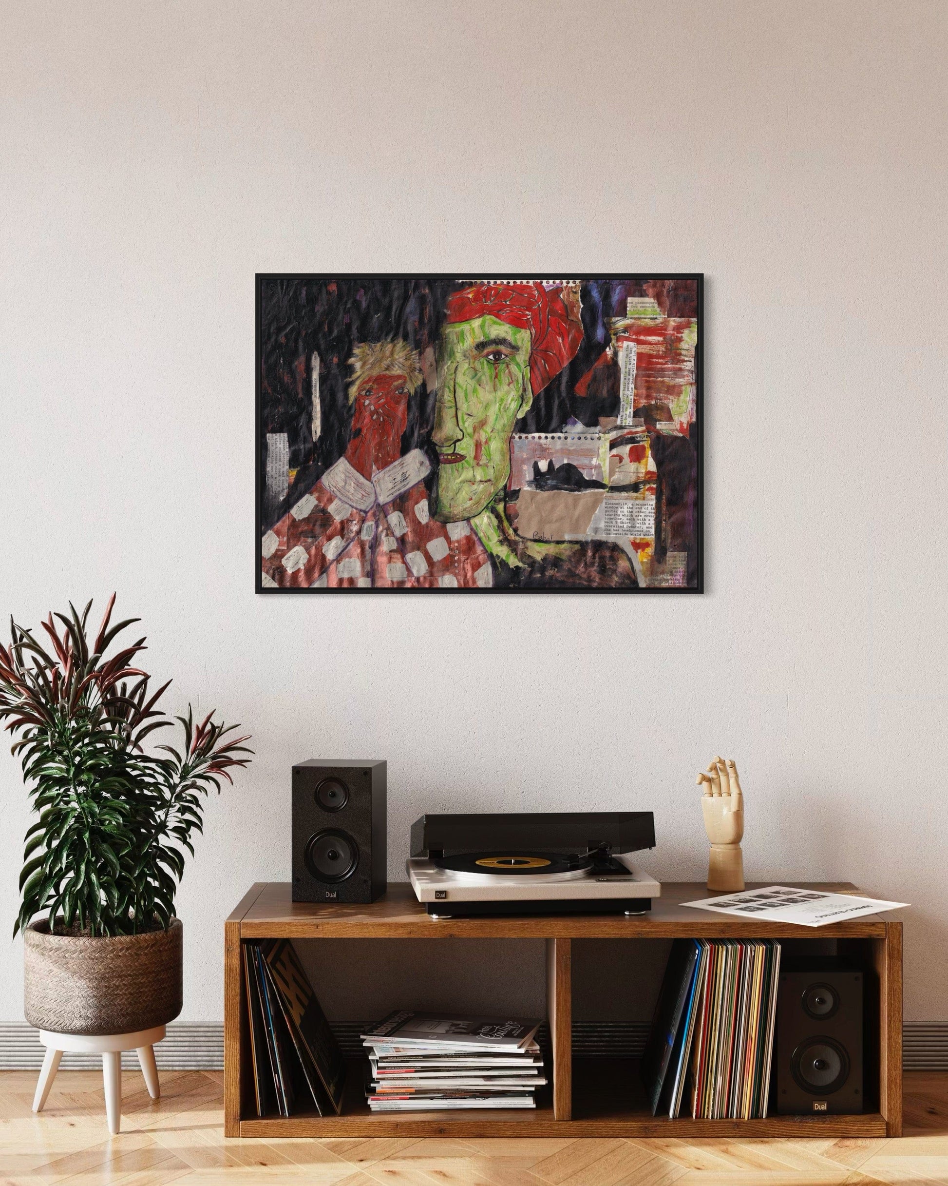 Living room with a wooden shelf, speakers, and a colorful abstract painting on the wall.