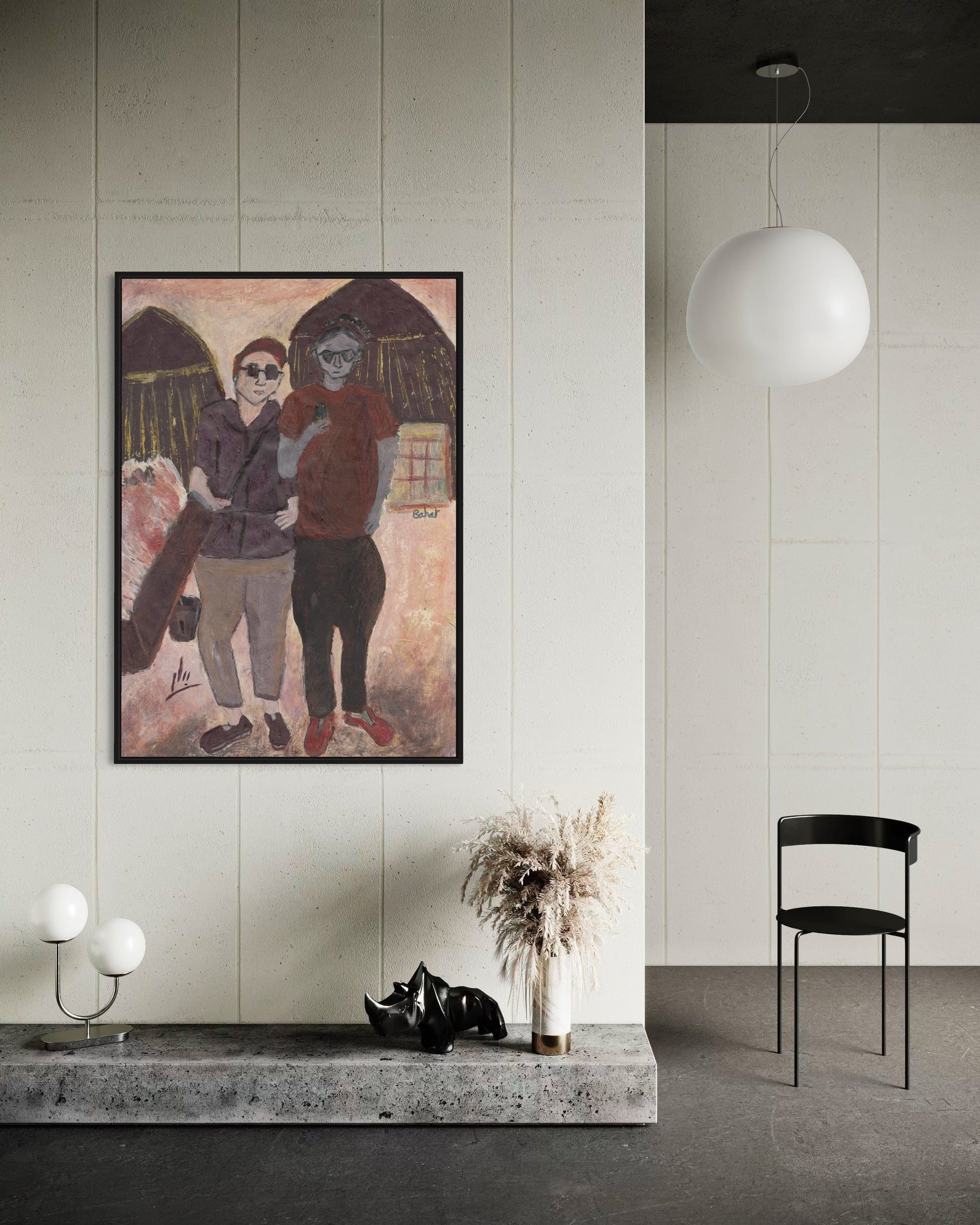 Framed artwork of two people on a wall in a modern interior setting.