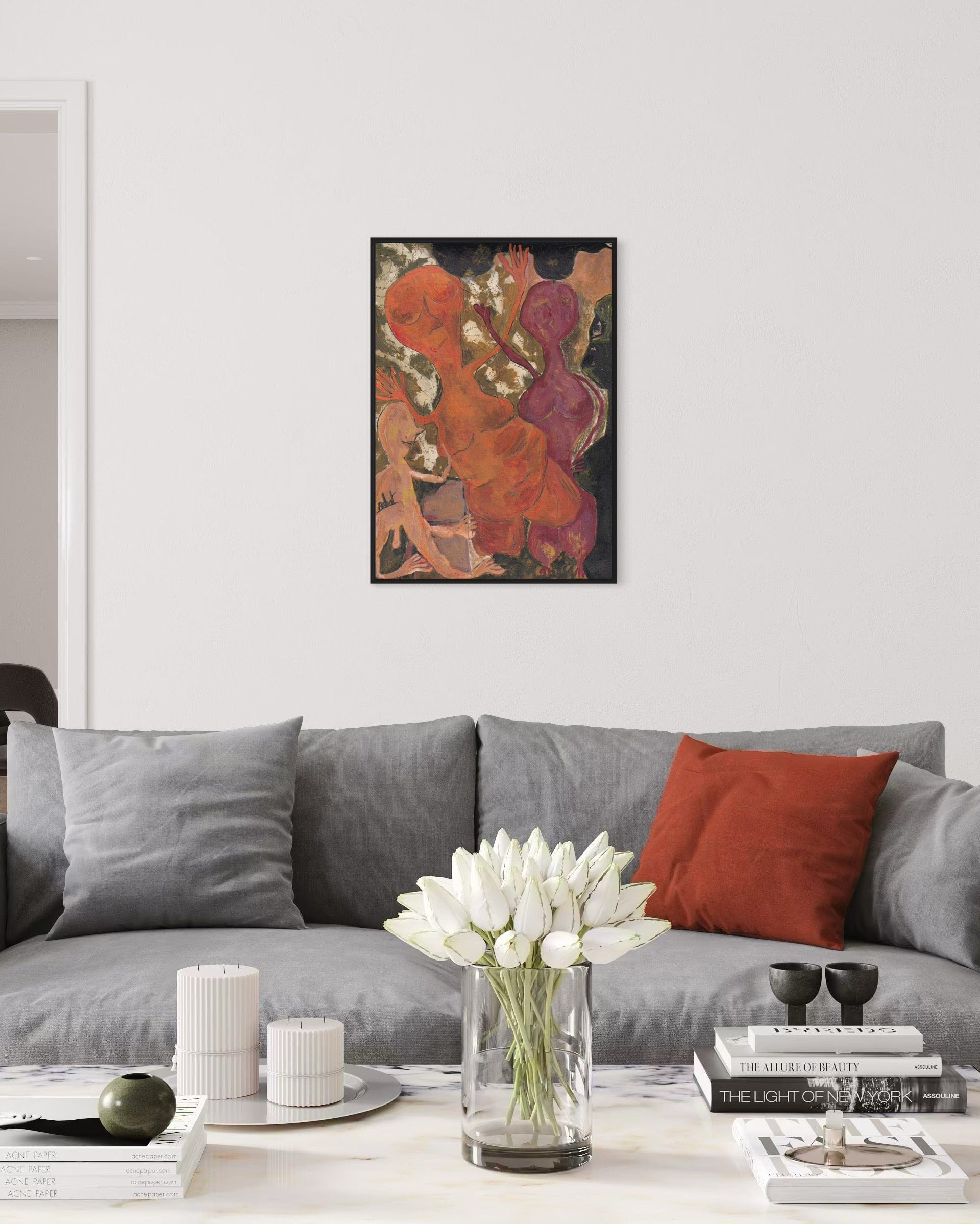 Living room with a gray sofa, red pillow, and a painting on the wall.