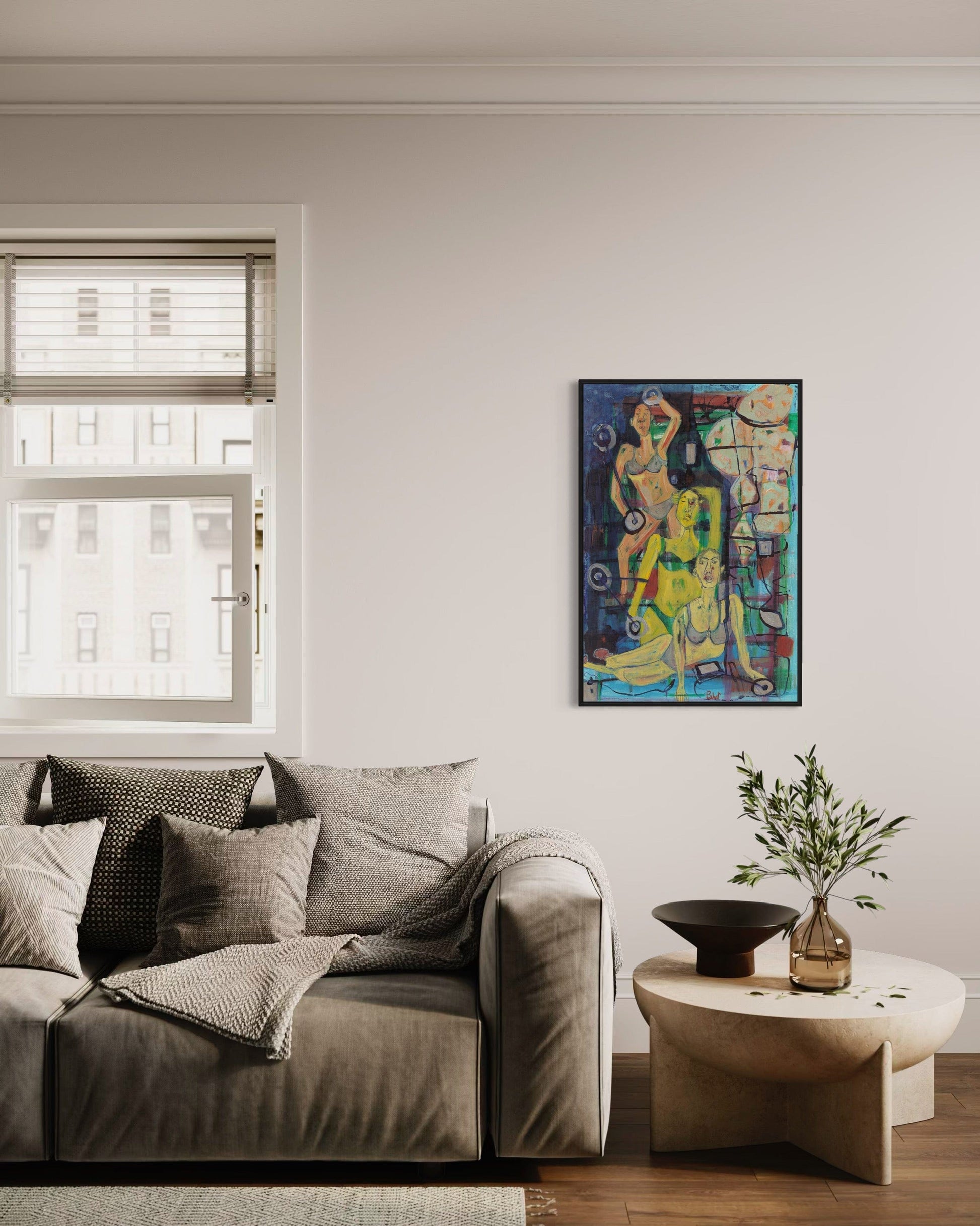 Living room with a gray sofa, colorful painting on the wall, and a small table with a plant.
