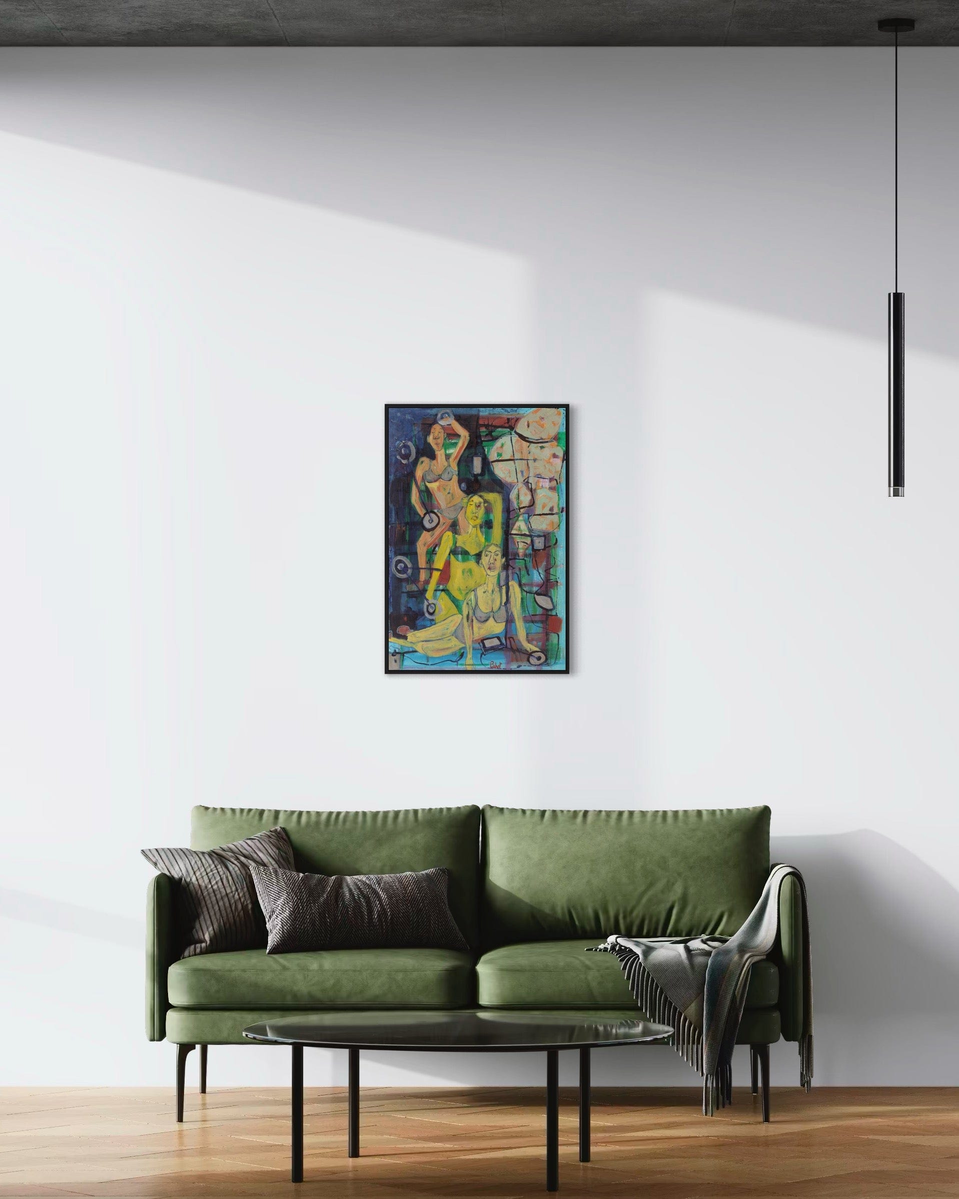 Green sofa in a room with a colorful painting on the wall.