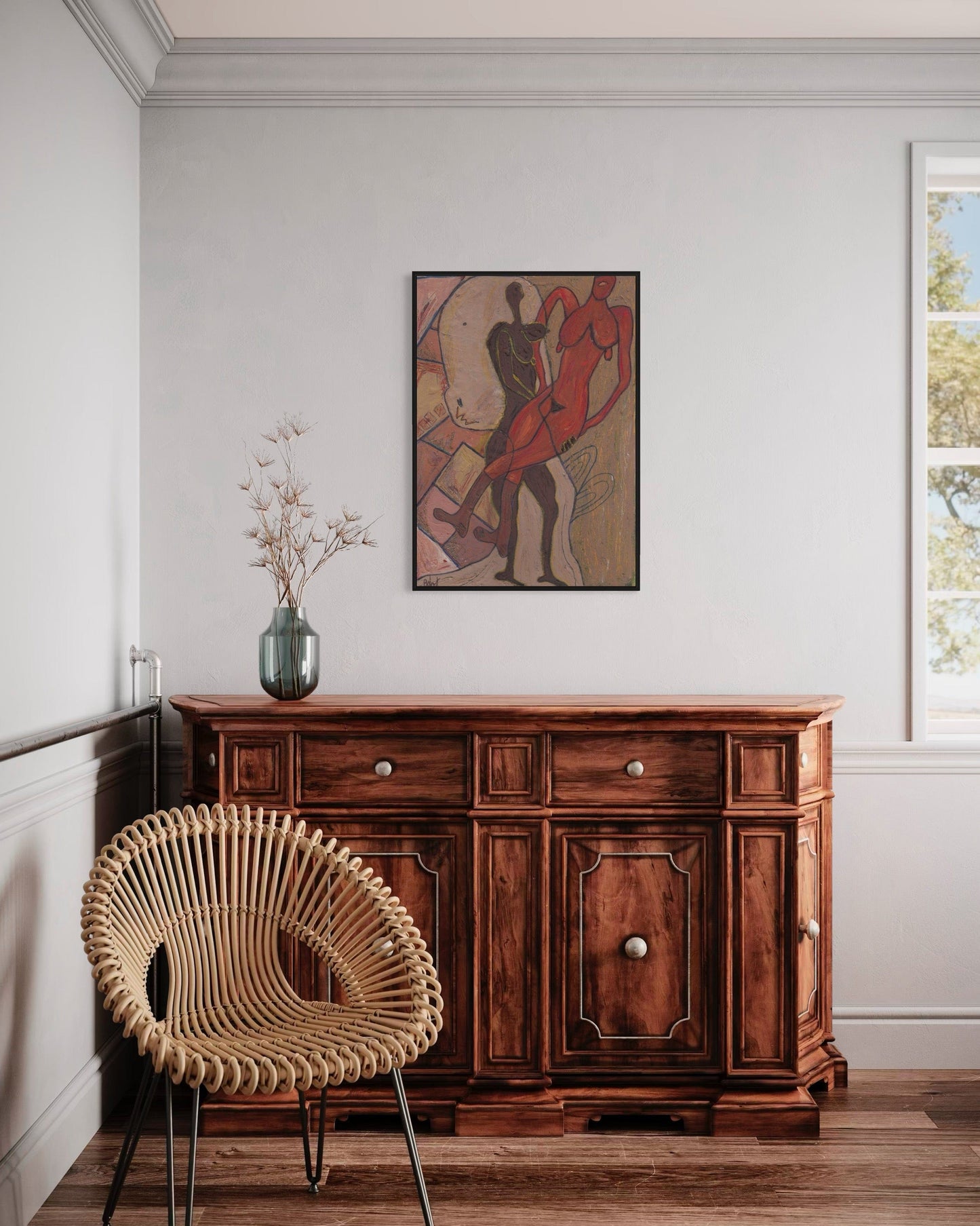 Wooden sideboard with a wicker chair and abstract painting in a room.