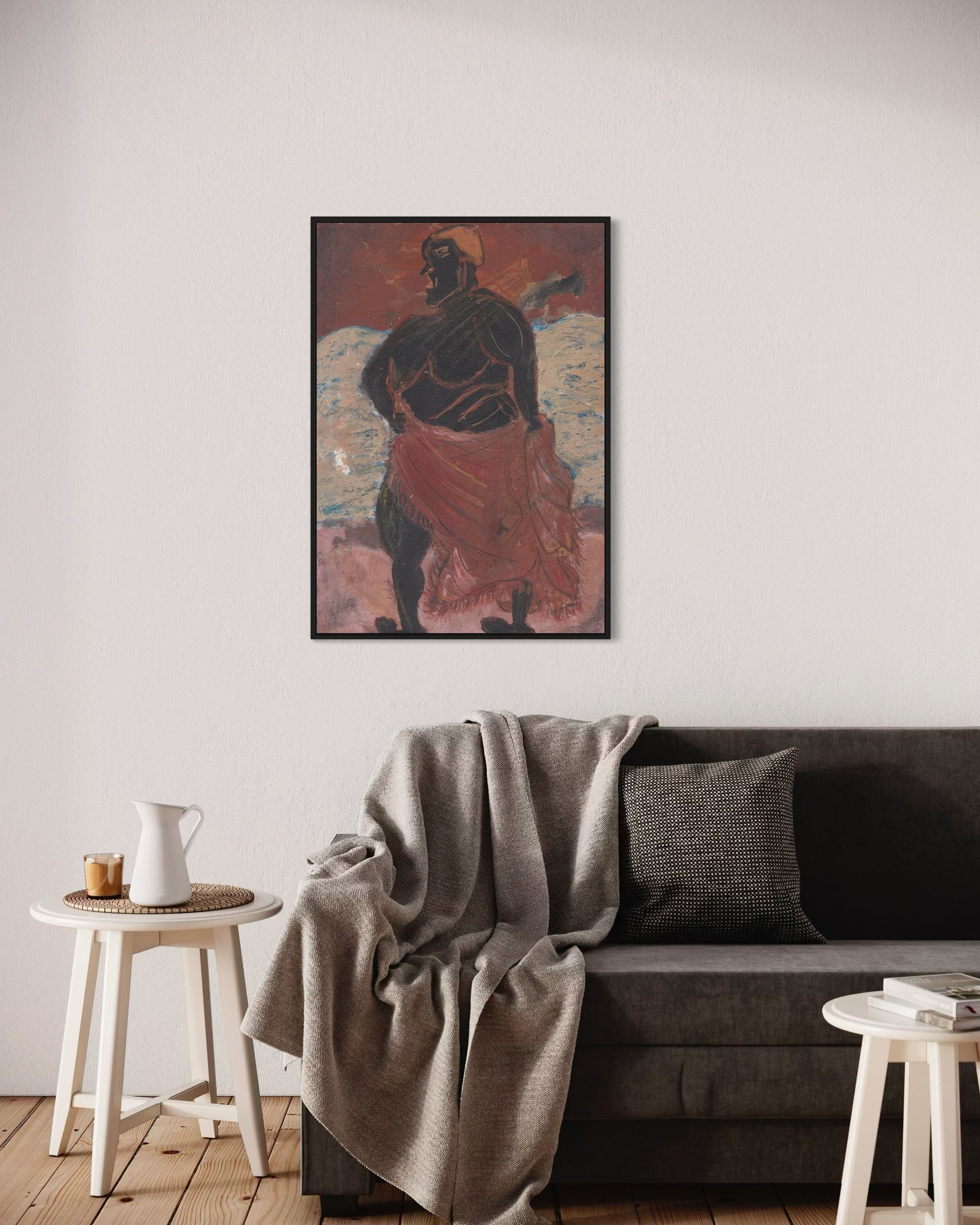 Framed artwork above a sofa in a living room setting