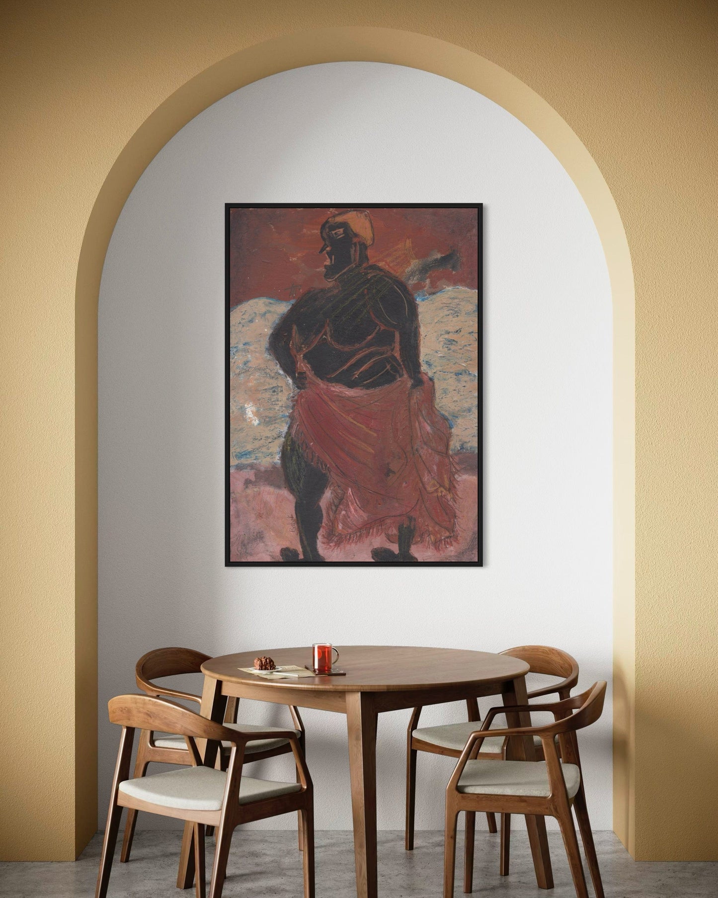 Dining room with wooden table and chairs, framed artwork on the wall.