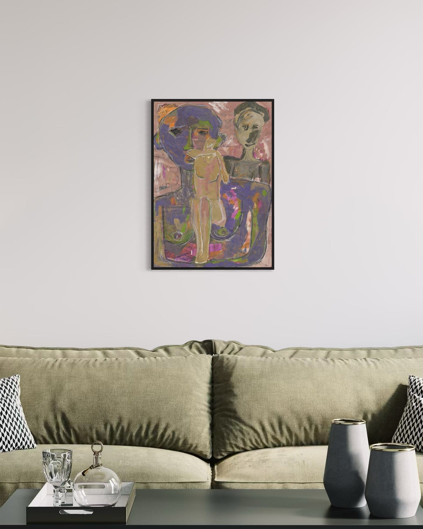 Framed abstract artwork on a wall above a sofa