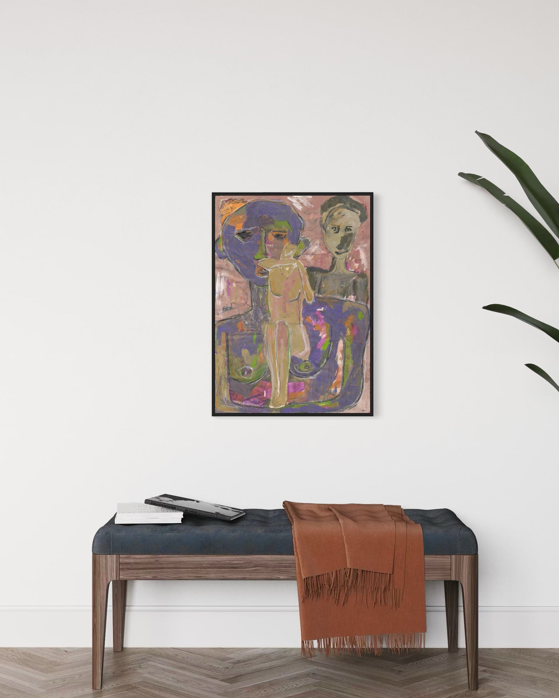Framed abstract artwork above a bench with a brown blanket in a room setting.