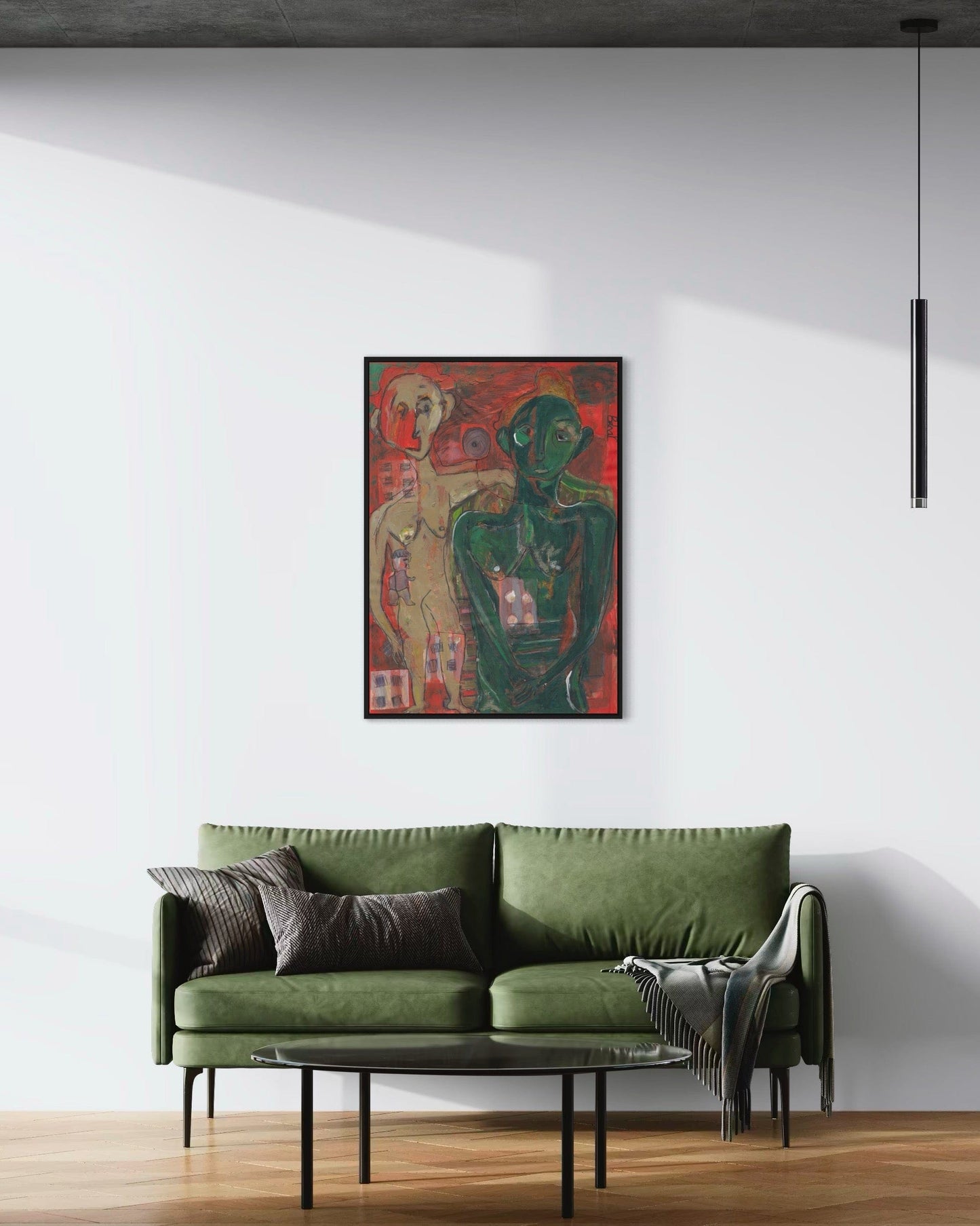 Green sofa in a room with a large painting on the wall