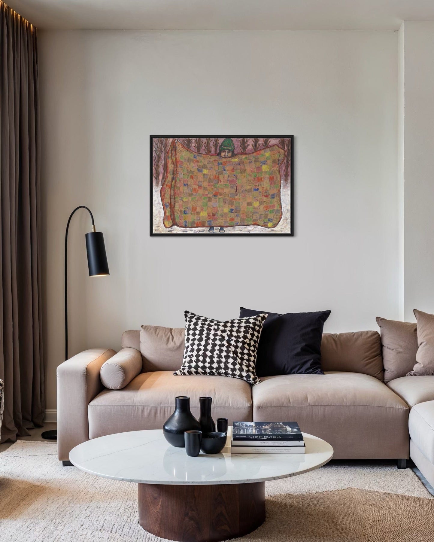 Modern living room with a beige sofa, coffee table, and decorative pillows.