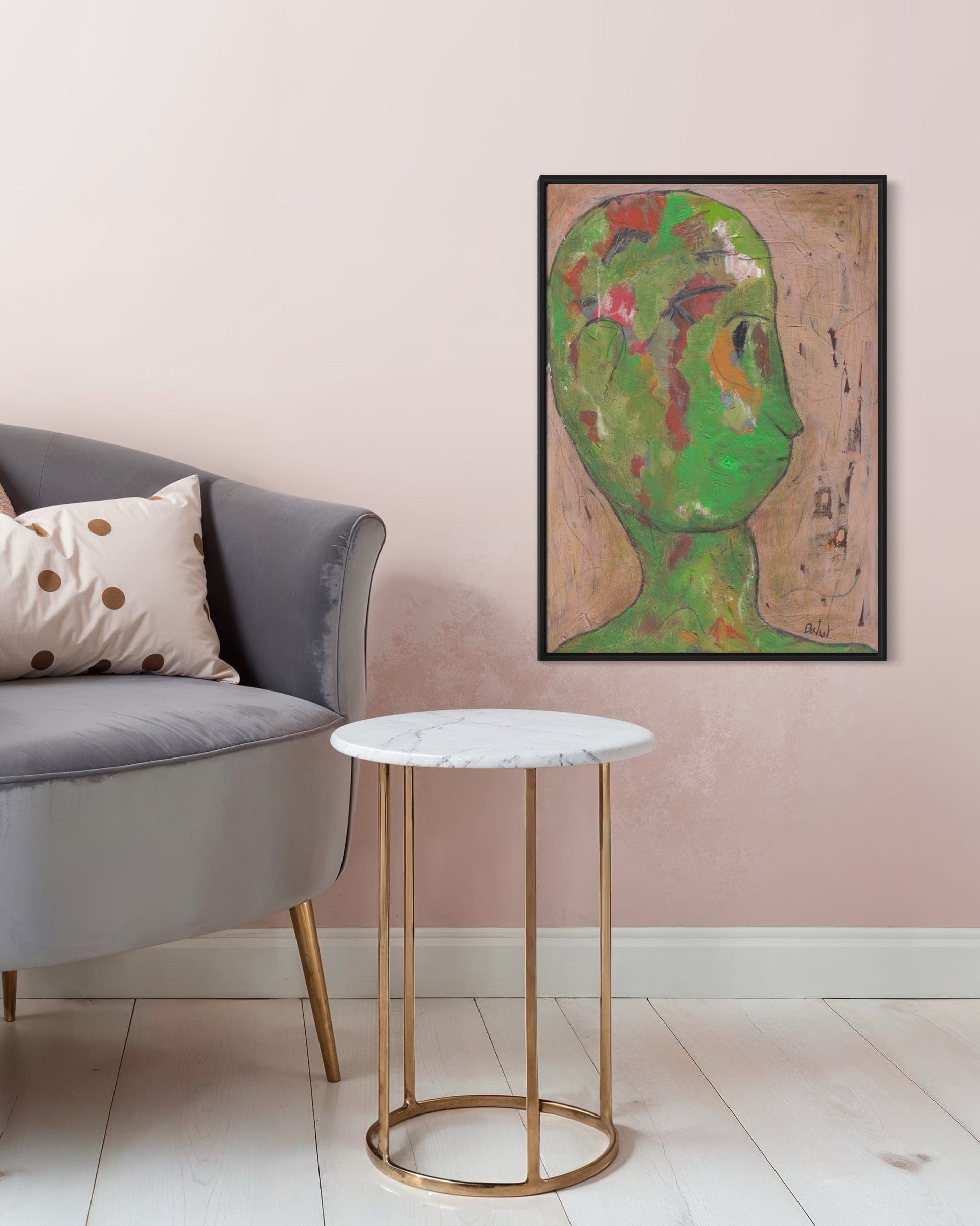 Living room with a gray sofa, marble side table, and colorful abstract painting on the wall.