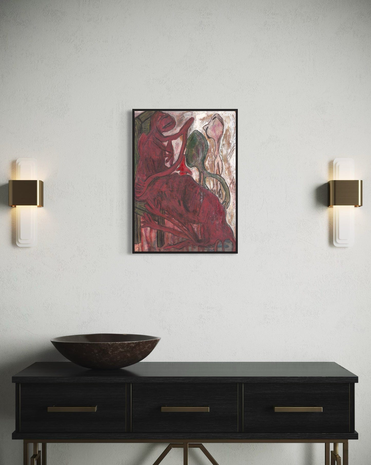Artistic wall piece above a black console table with wall sconces on a light gray wall.