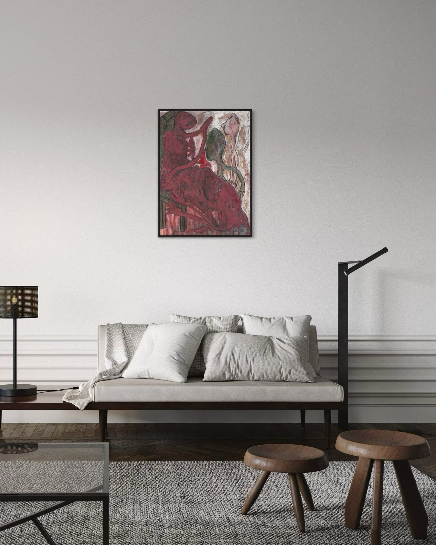 Living room with a sofa, ottomans, and a painting on the wall.