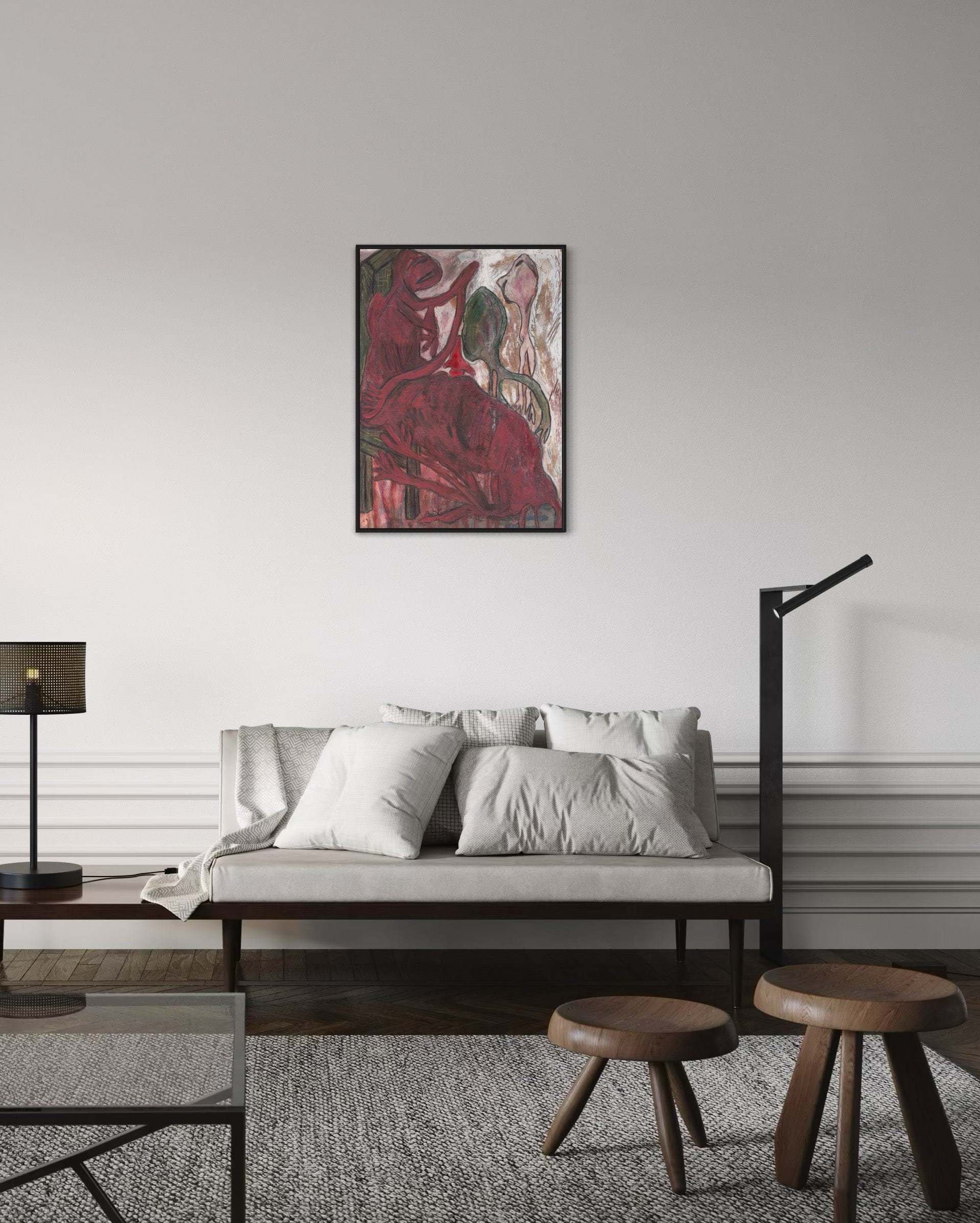 Living room with a sofa, ottomans, and a painting on the wall.