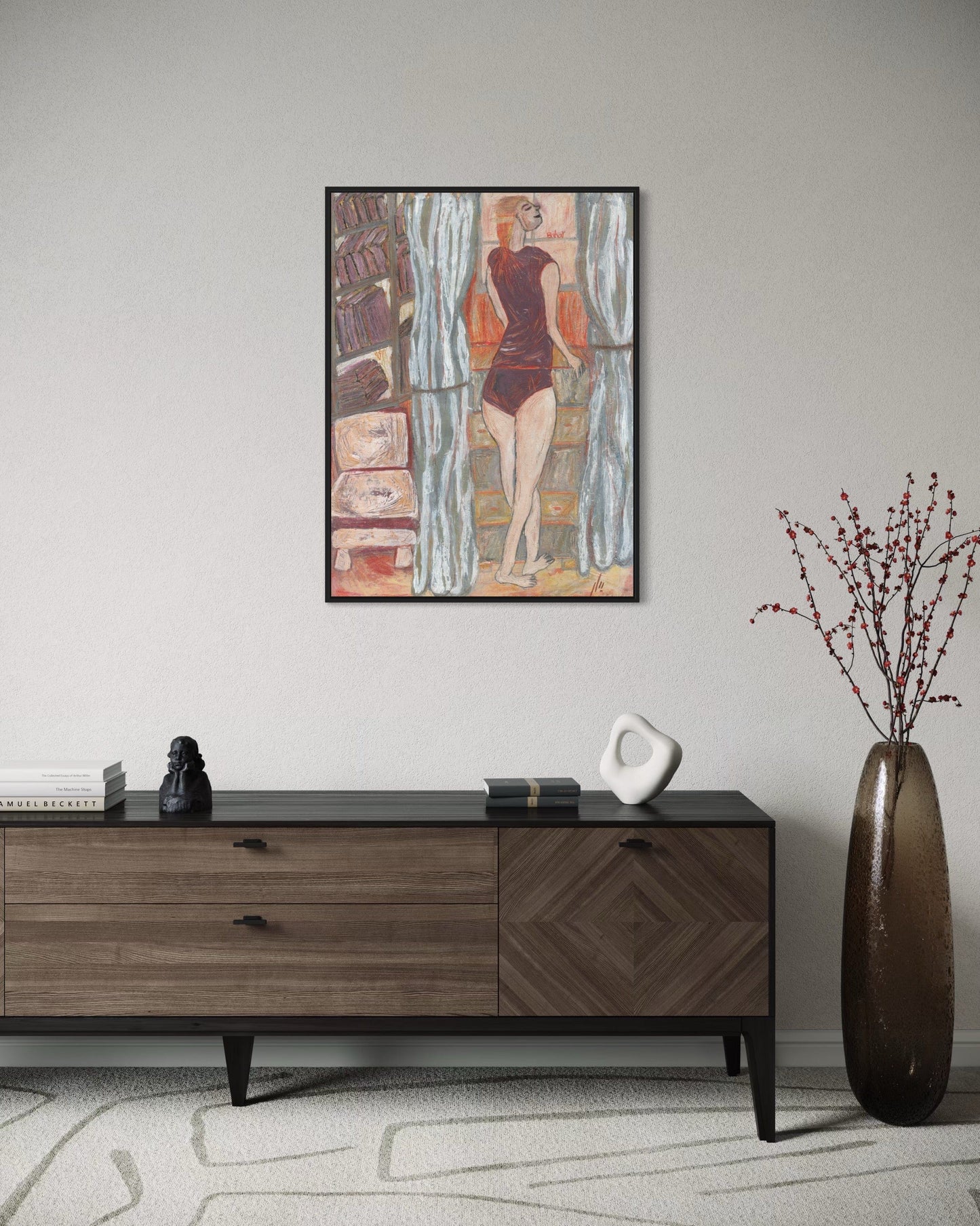Framed artwork above a wooden sideboard in a room with decorative elements.