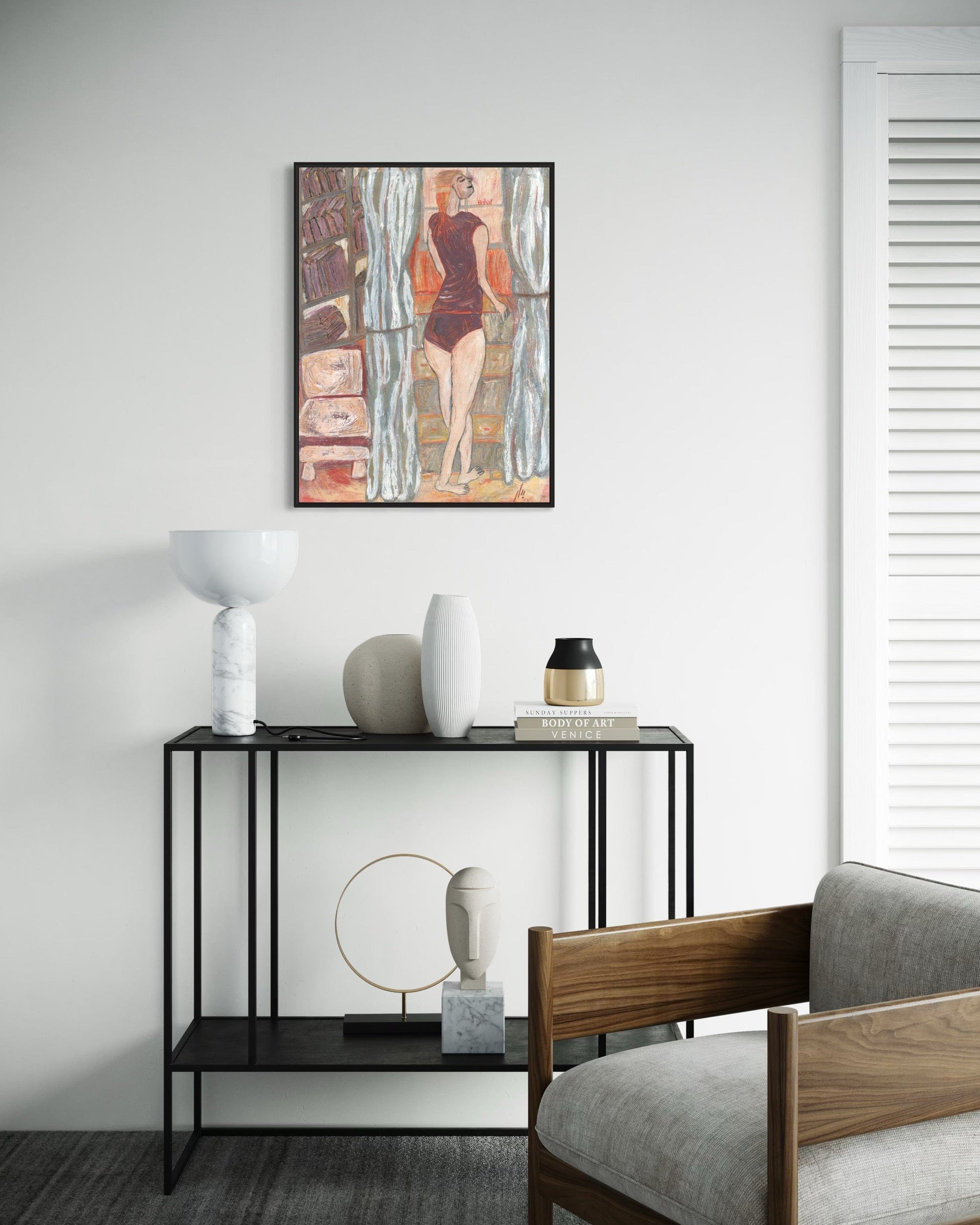 Modern interior with a console table, decorative items, and a framed artwork on a wall.