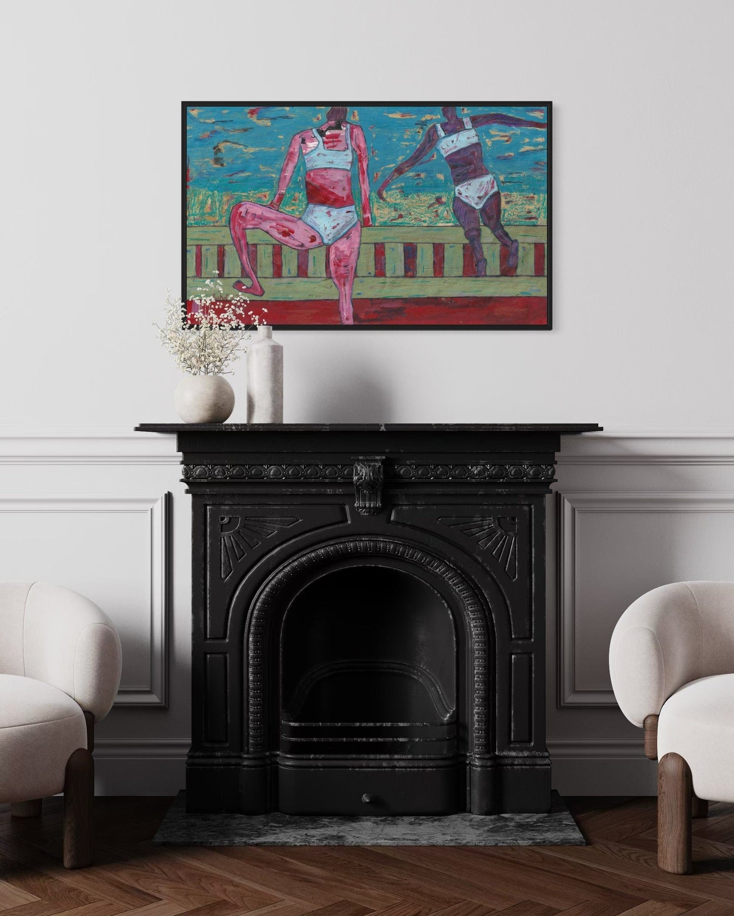 Colorful abstract painting above a black fireplace in a room with white walls and wooden flooring.