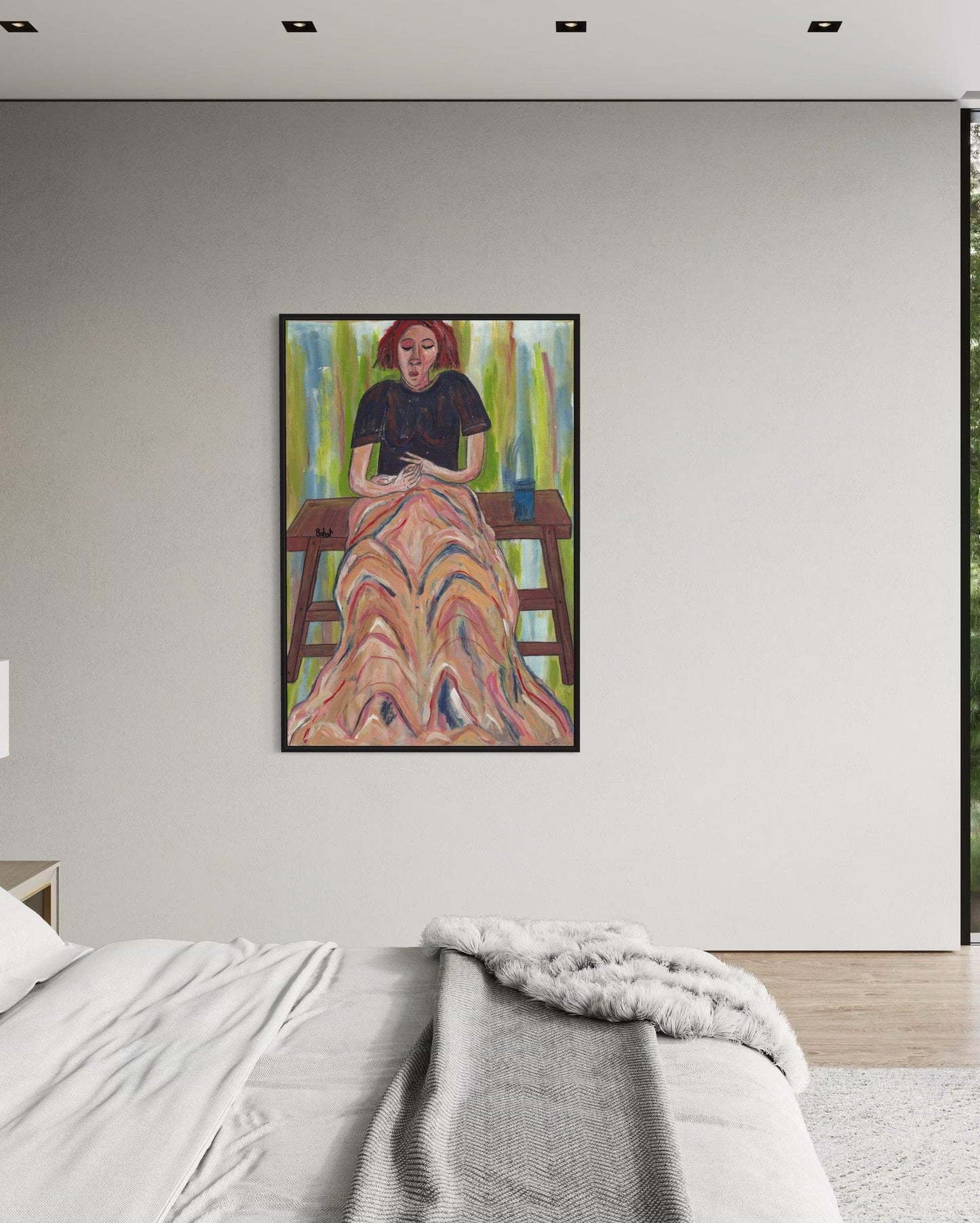 Framed artwork on a wall above a bed in a bedroom