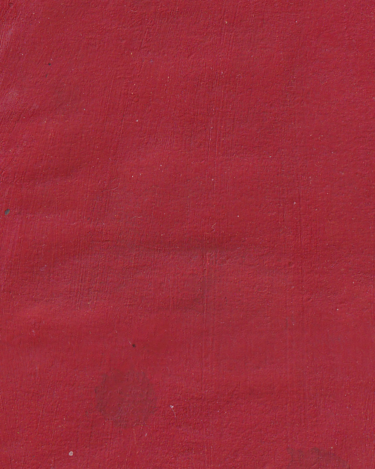 Solid red color swatch with a textured surface