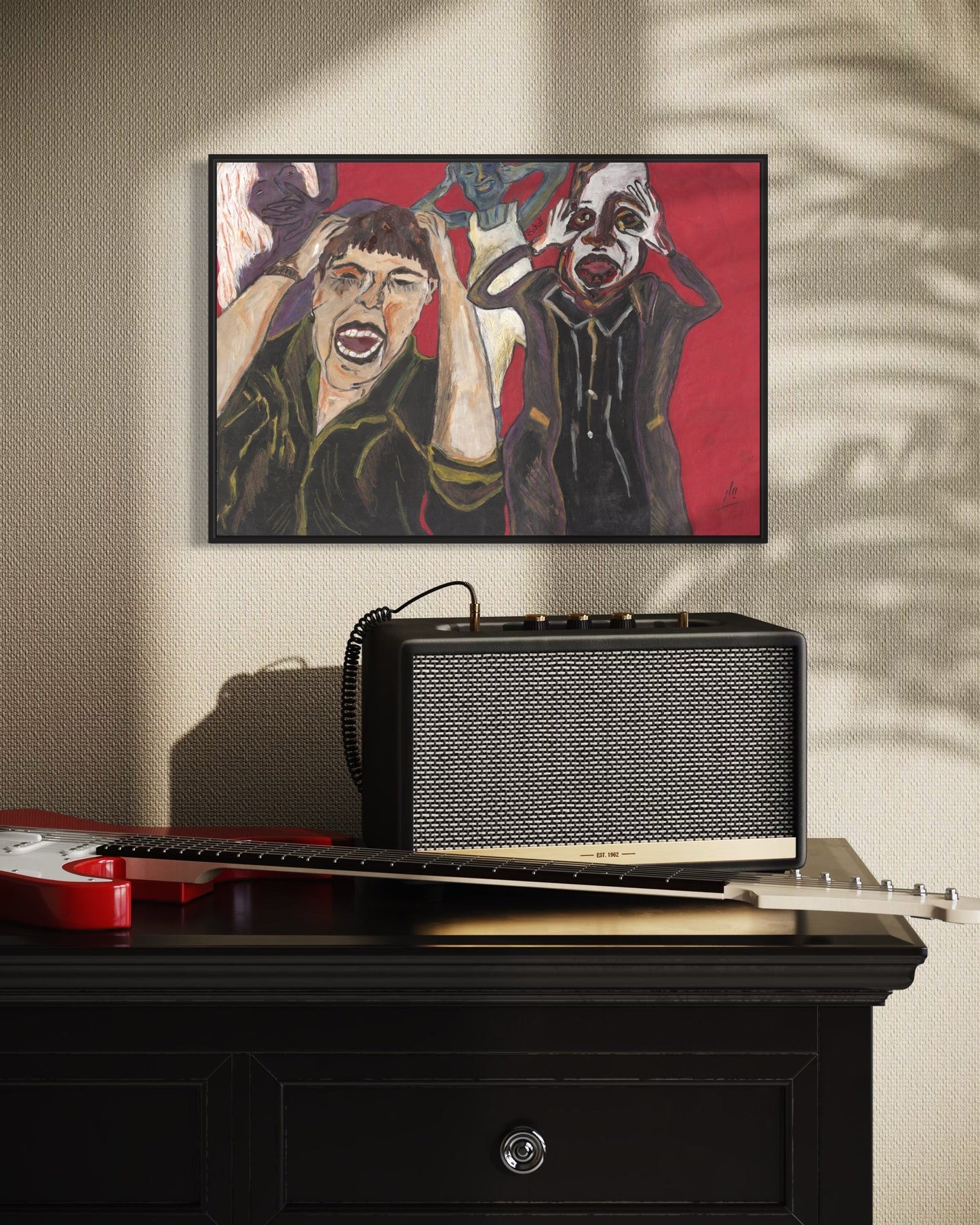 Black radio on a wooden surface with a painting above it