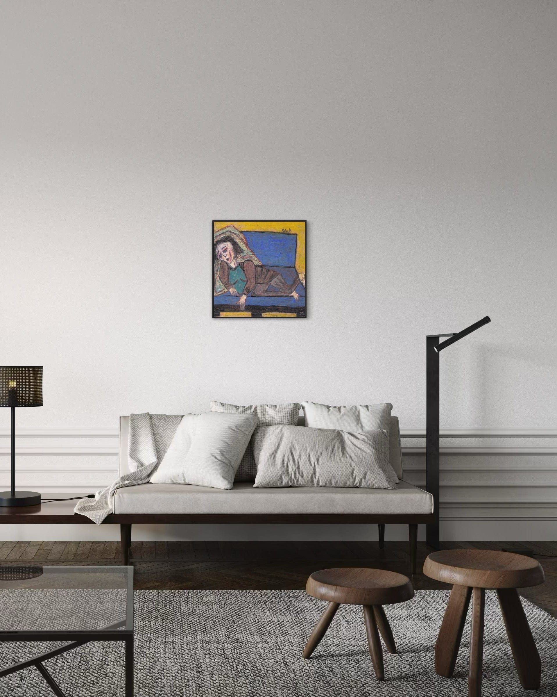 Modern living room with a sofa, coffee table, and wall art.