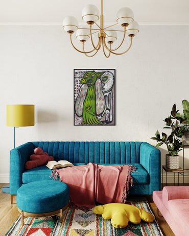 Living room with a blue sofa, pink chair, and colorful rug.