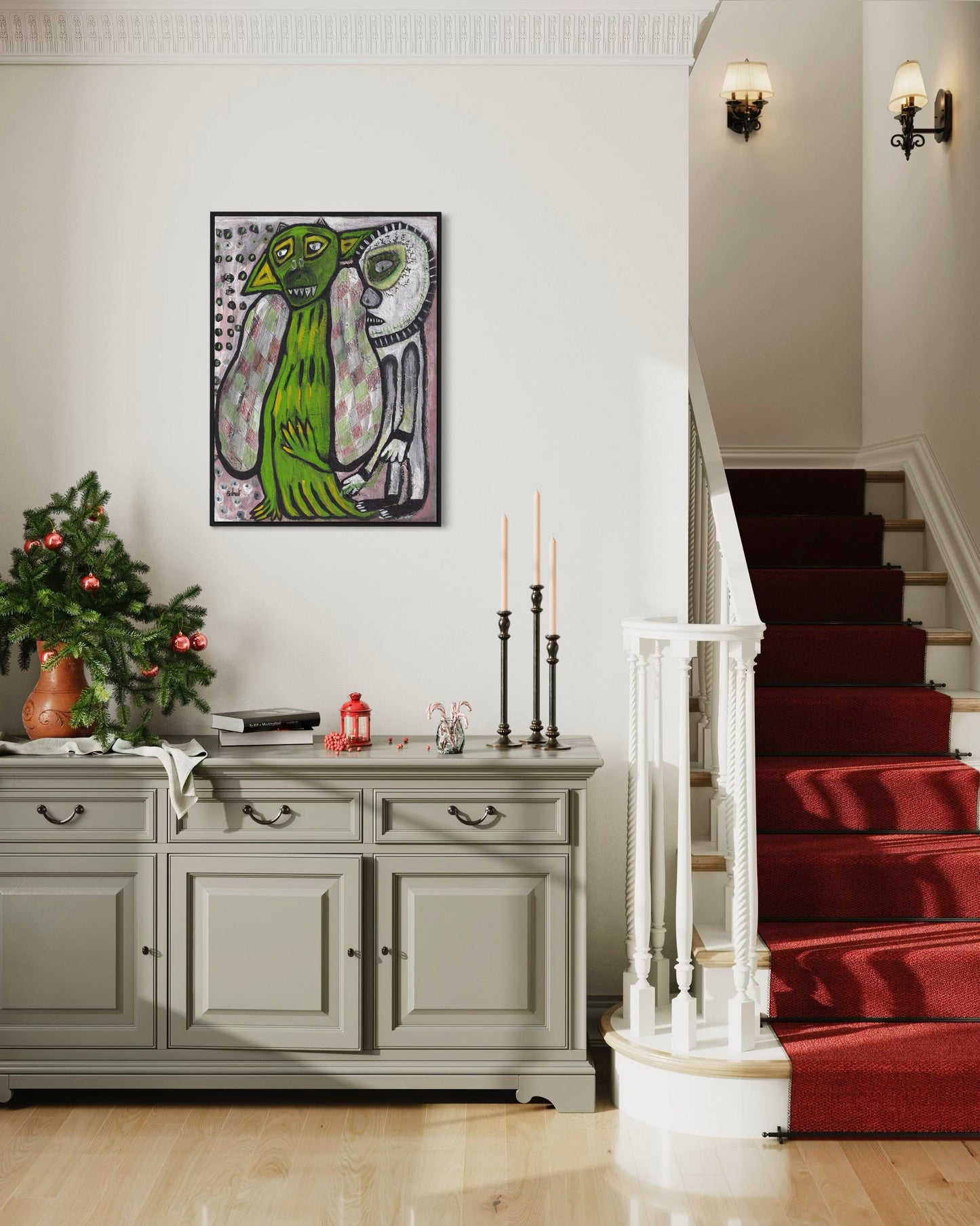 Foyer with a staircase, decorative cabinet, and framed artwork on a wall.