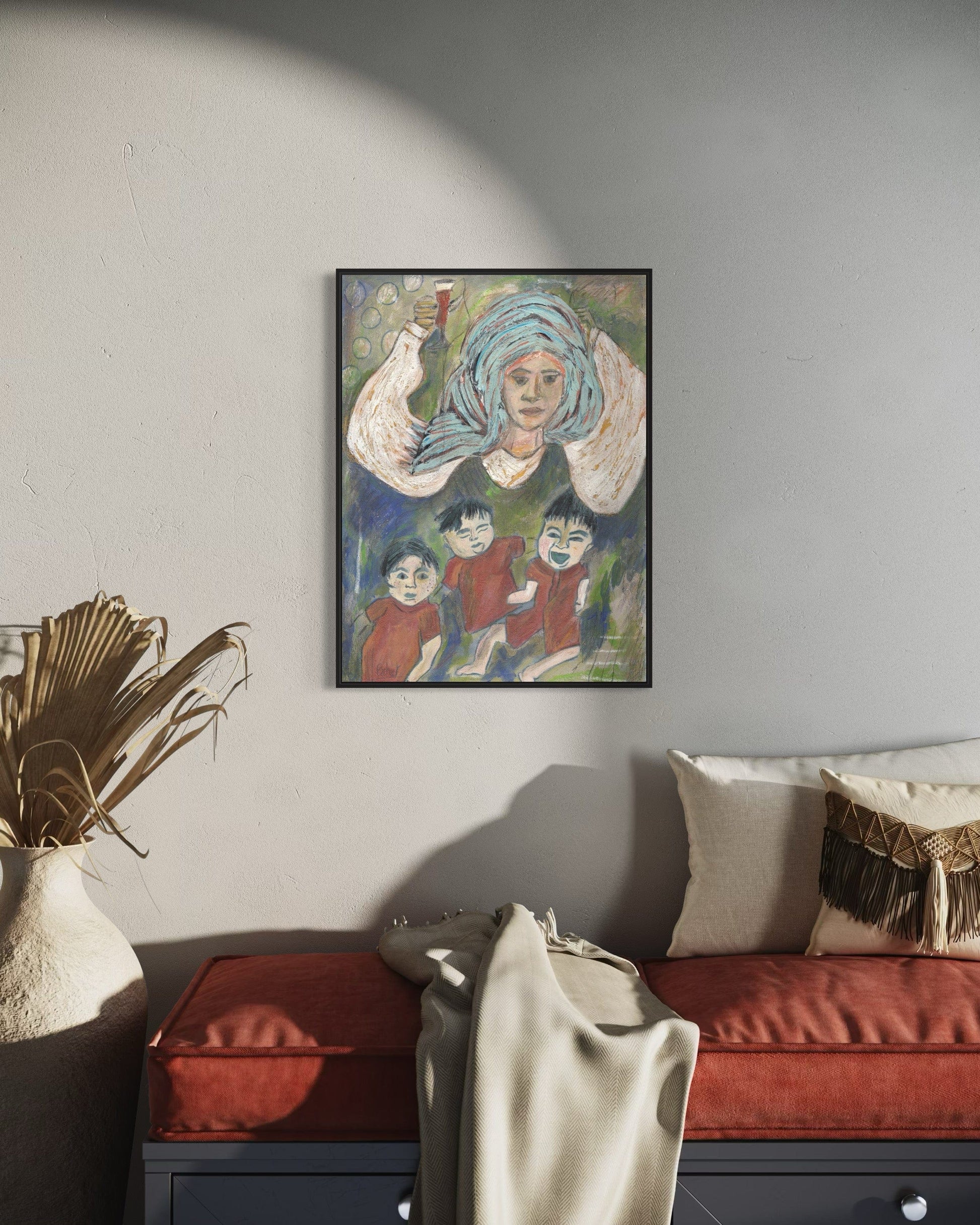 Framed artwork on a wall above a sofa in a living room setting