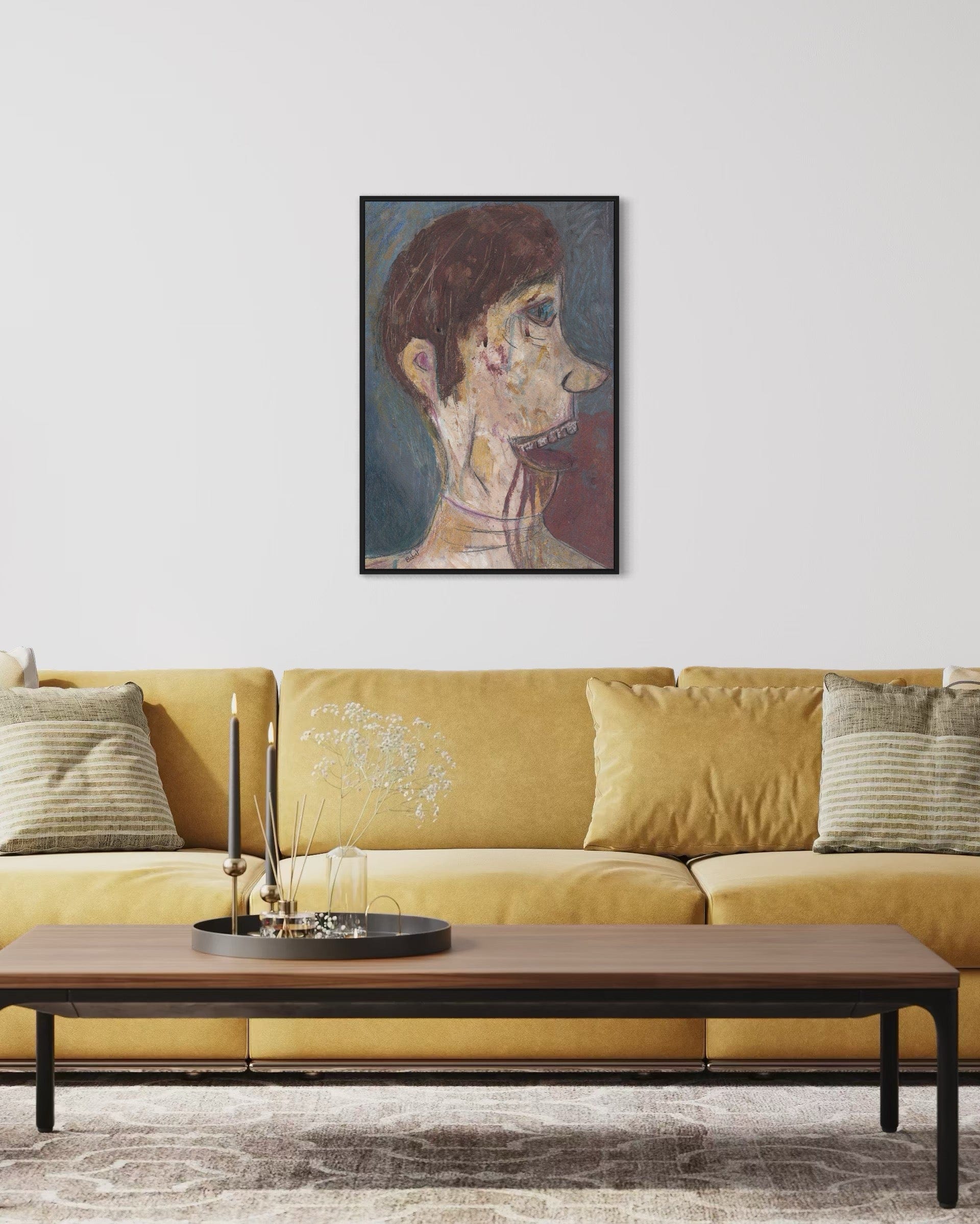 Framed artwork above a yellow sofa in a living room setting