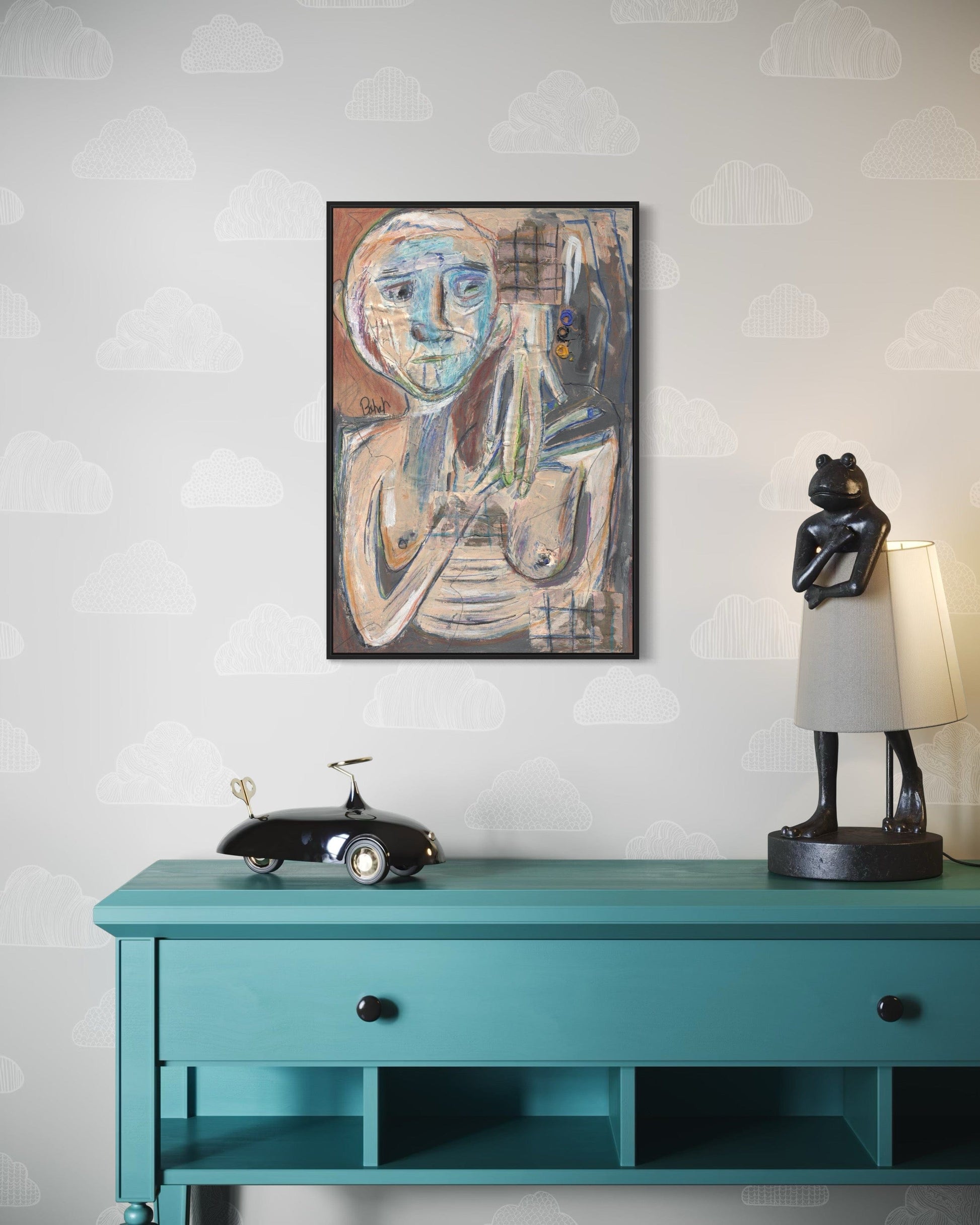 Teal console table with decorative items against a light gray wall with a subtle pattern.