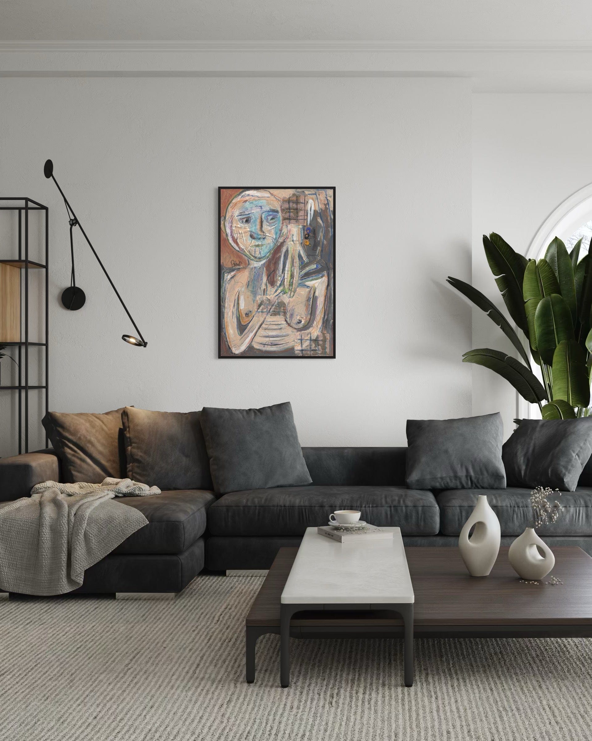 Modern living room with a gray sectional sofa, coffee table, and decorative items.