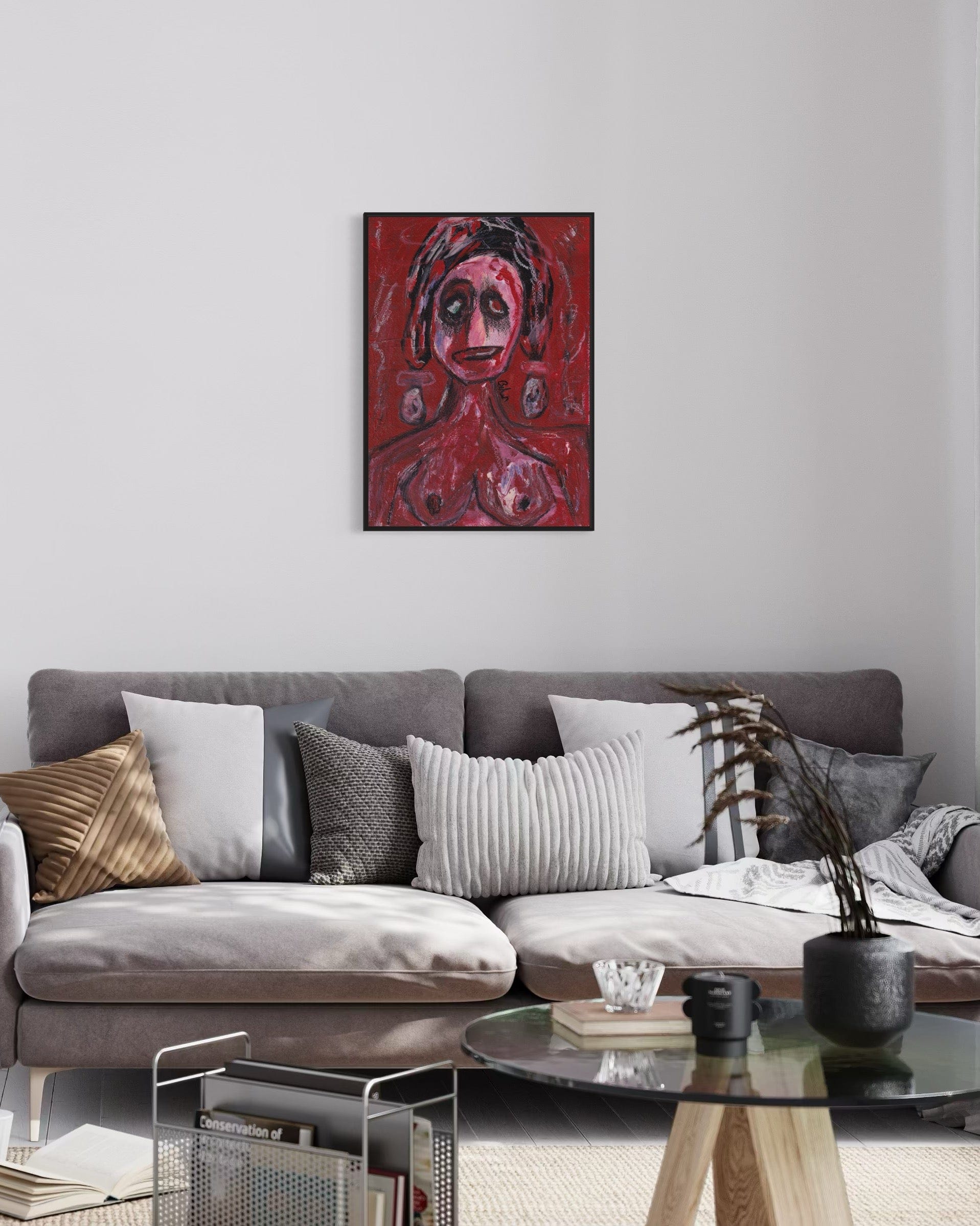 Living room with a gray sofa, decorative pillows, and a red abstract painting on the wall.