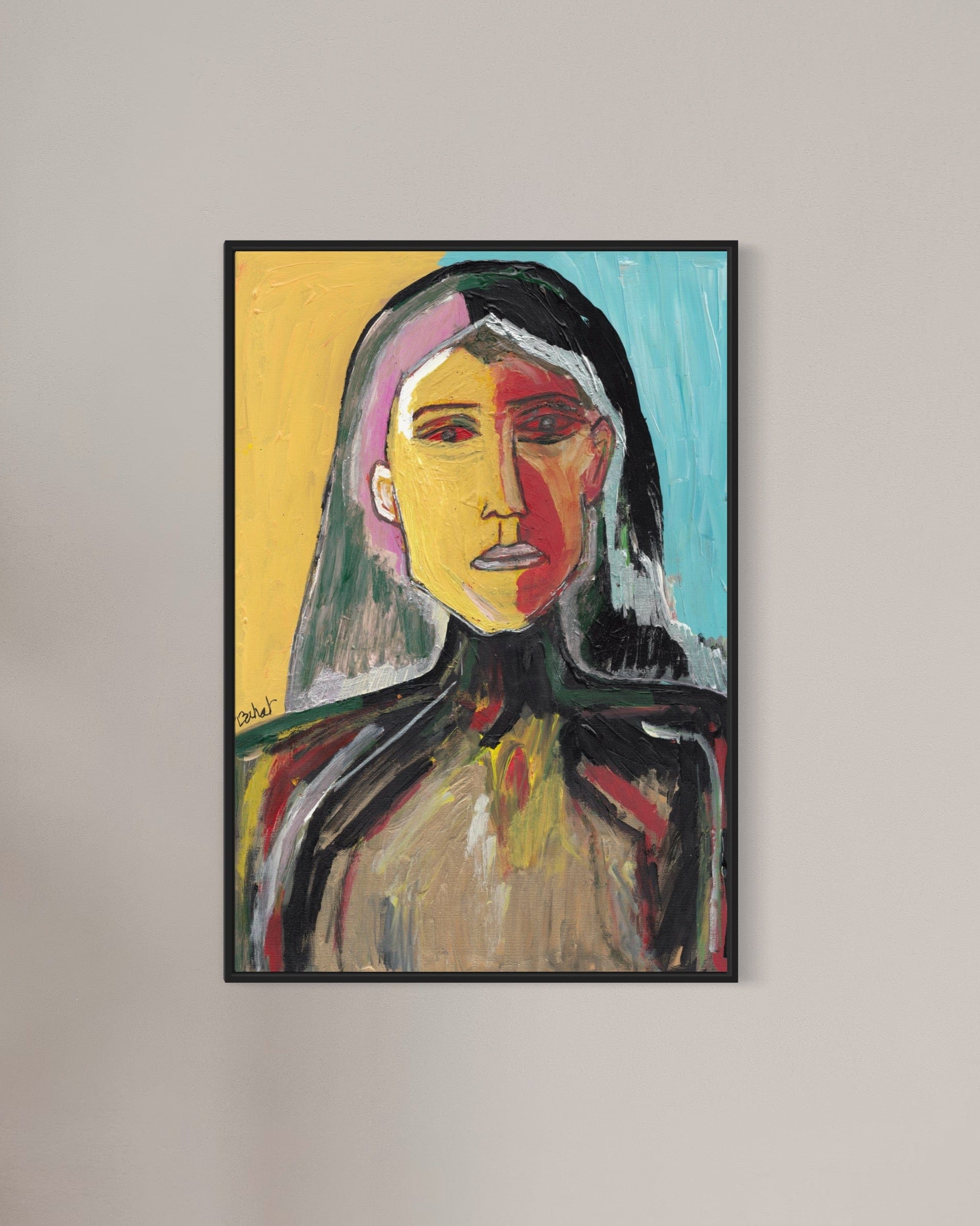 Framed abstract portrait painting on a plain wall