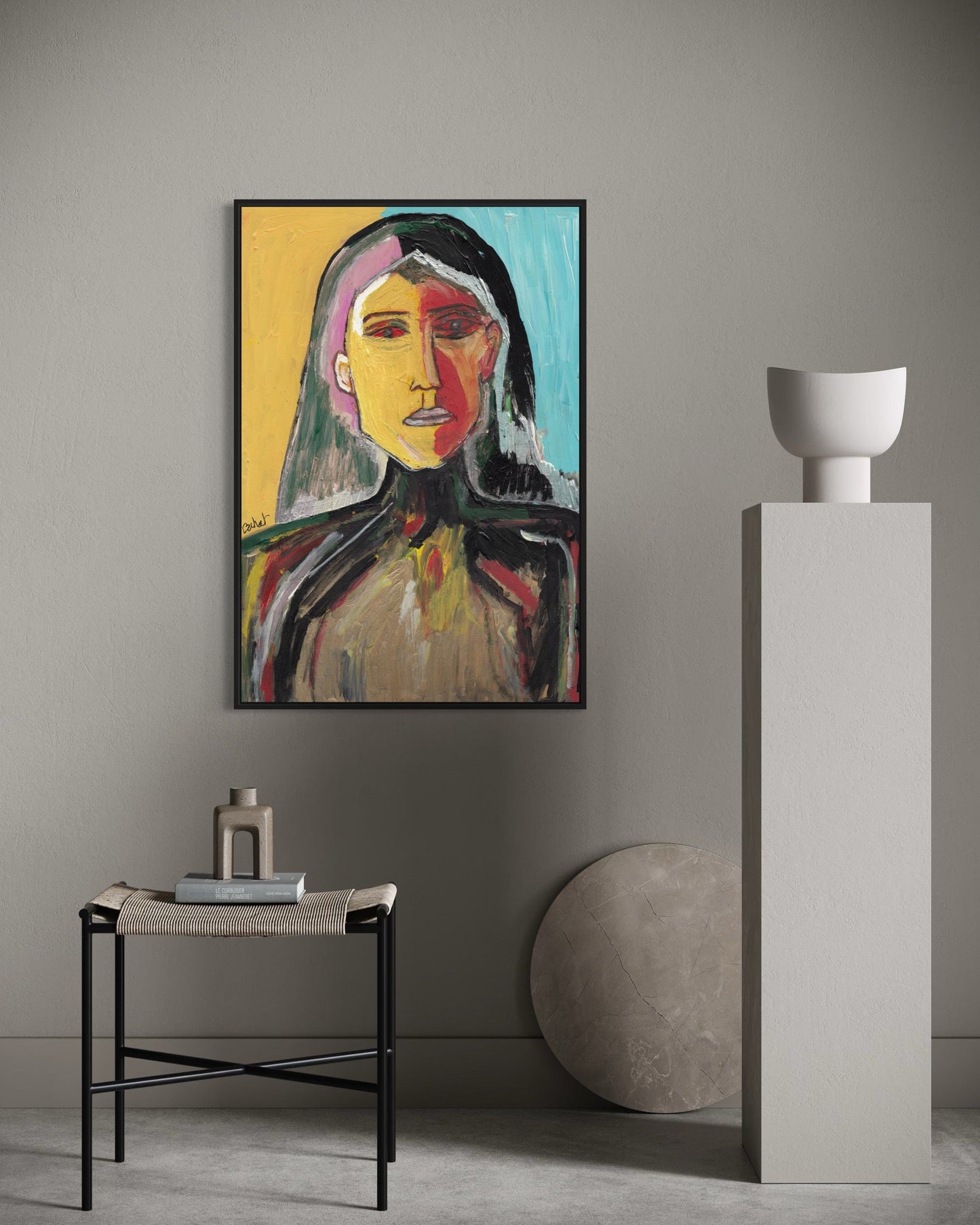 Abstract painting of a woman's face on a wall in a modern interior setting.