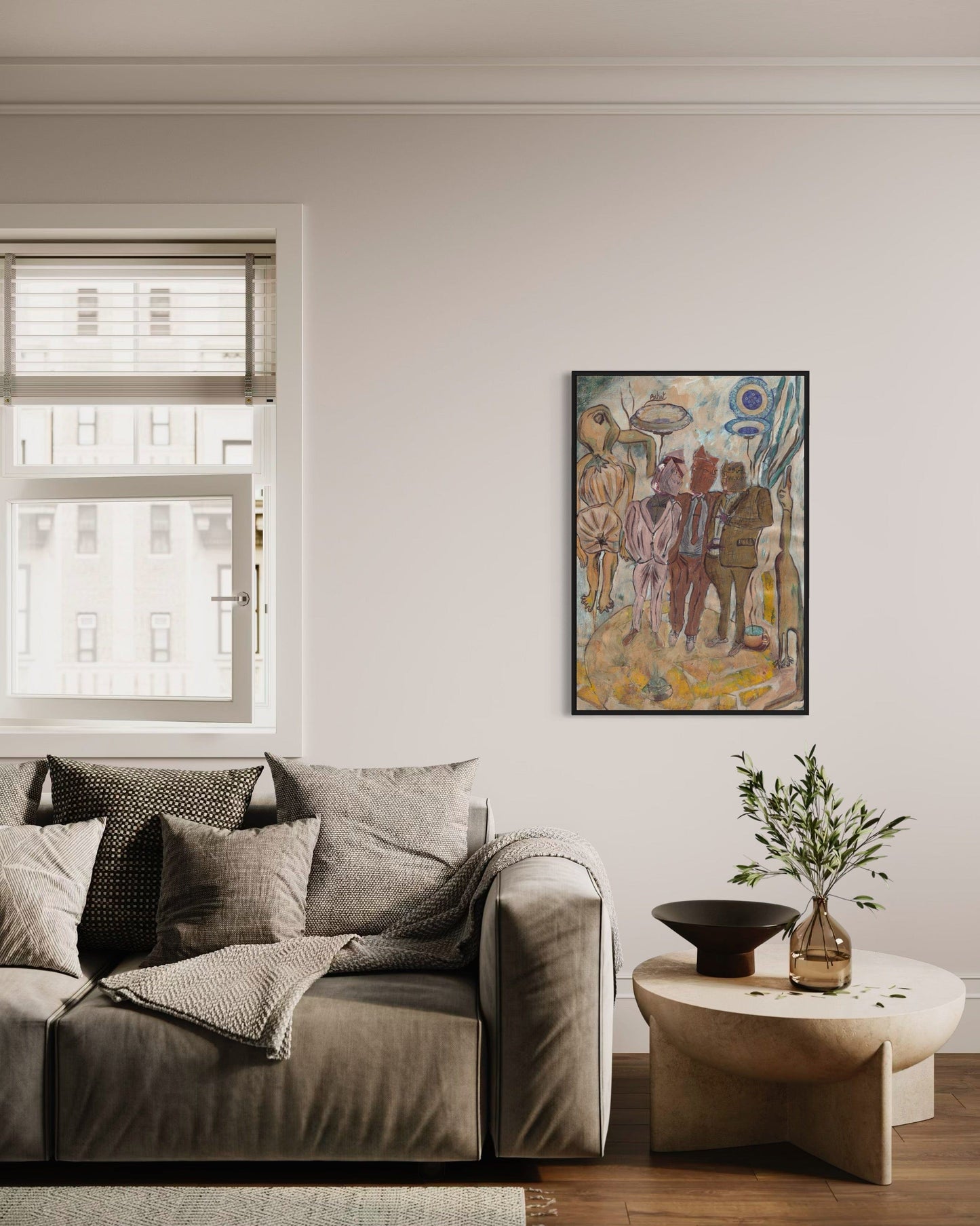 Living room with a gray sofa, coffee table, and colorful wall art.
