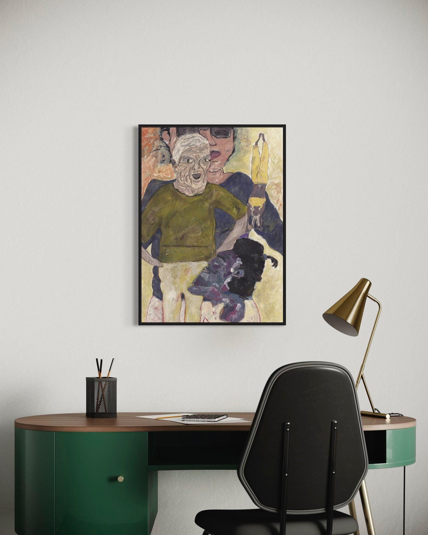 Modern office setup with a desk, chair, and framed artwork on the wall.