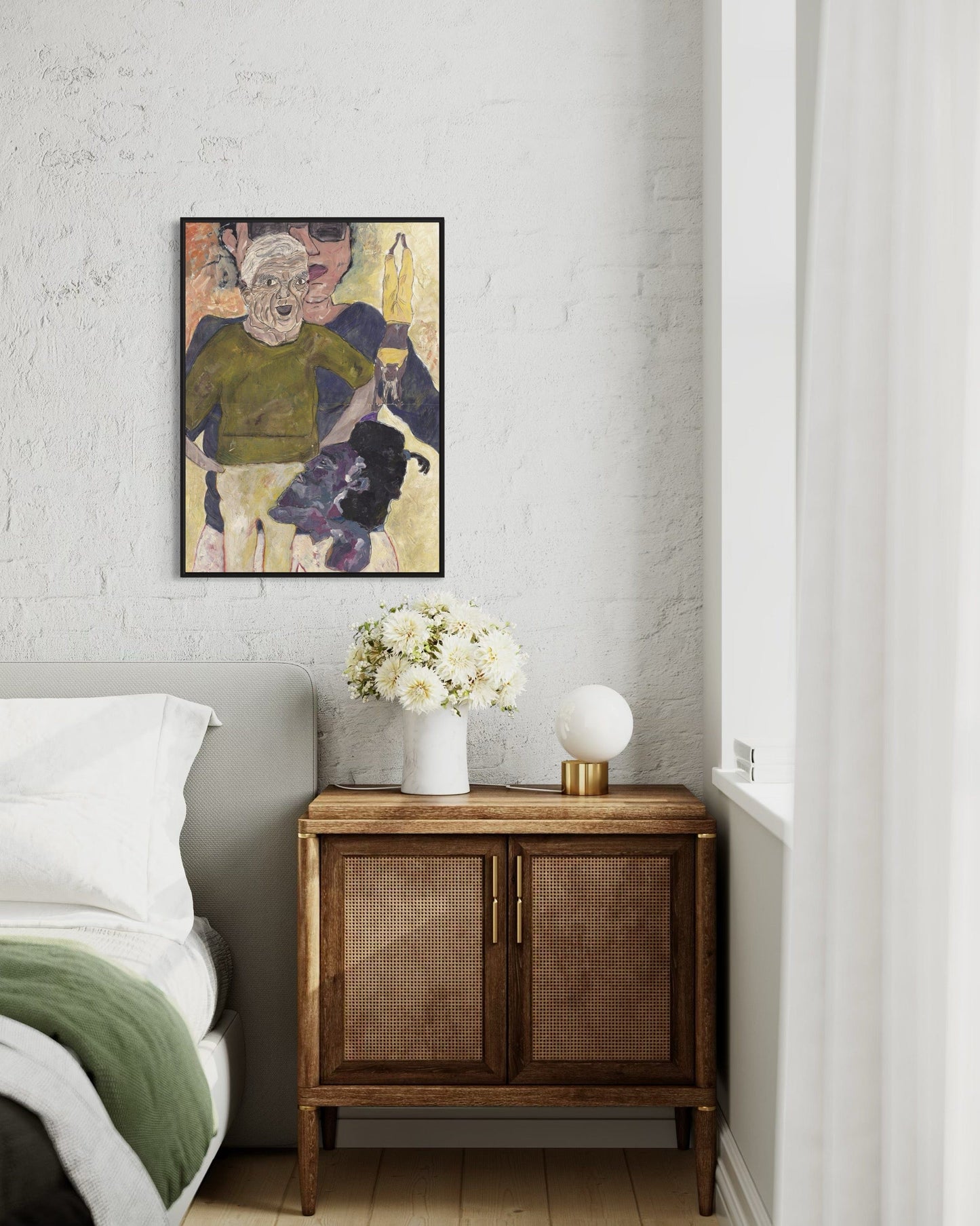 Room interior with a bed, wooden cabinet, and framed artwork on the wall.
