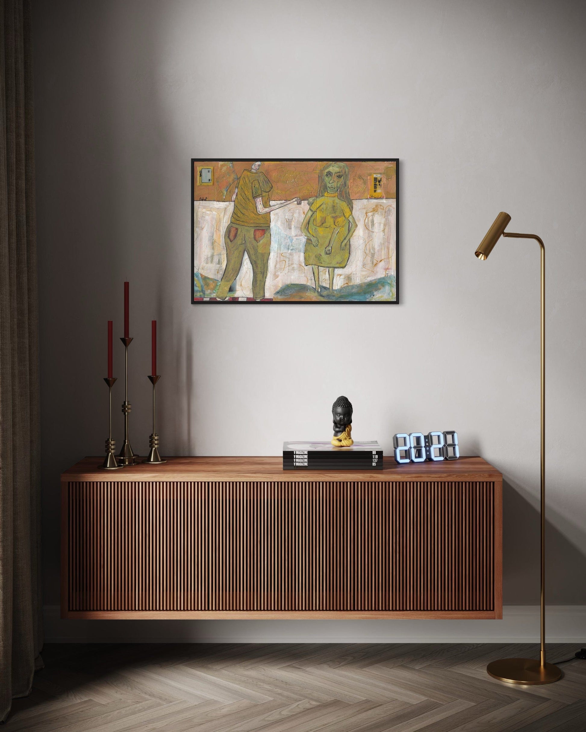 Wooden console table with decorative items against a wall with a painting