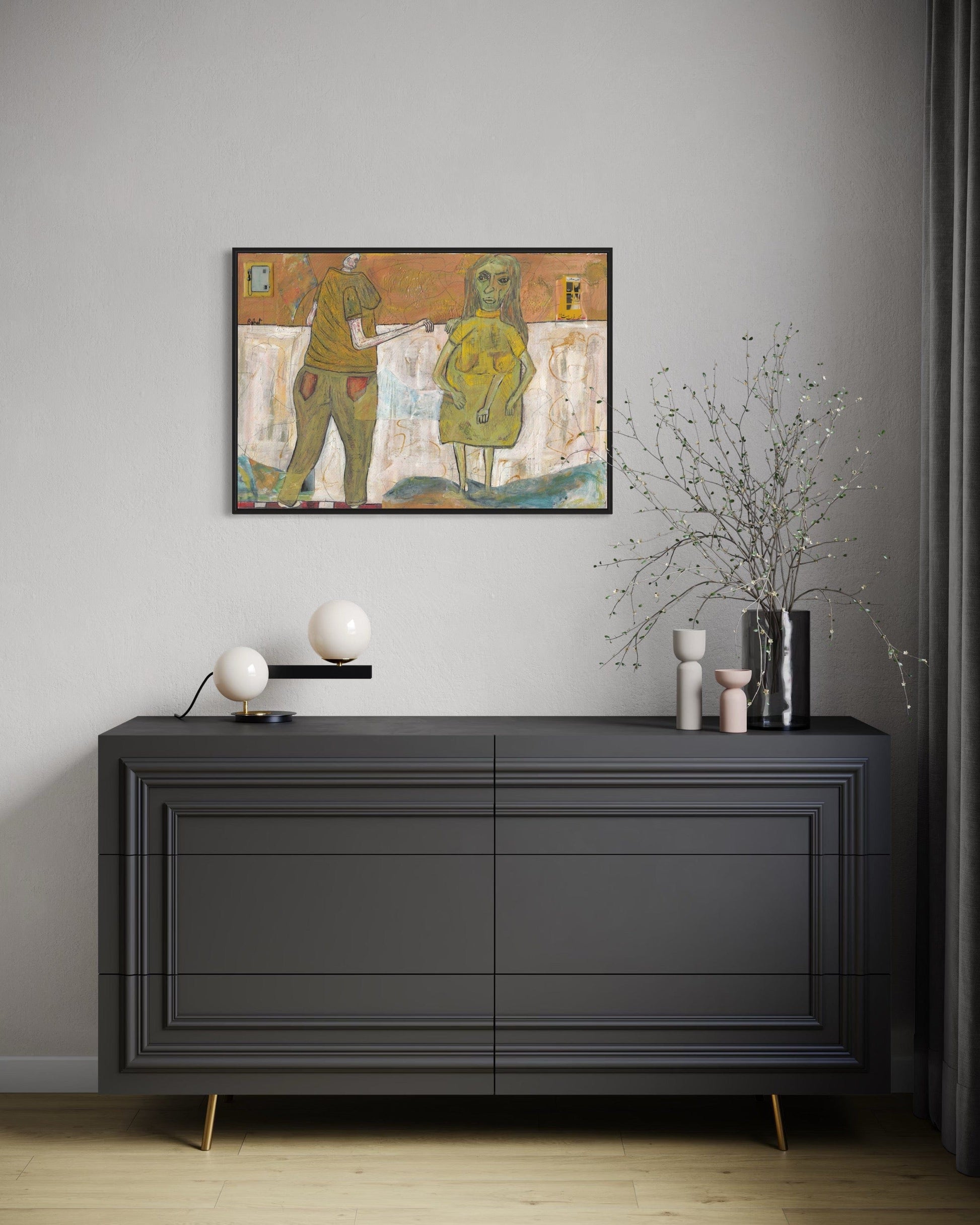 Modern interior with a dark gray dresser, decorative items, and a framed artwork on a gray wall.