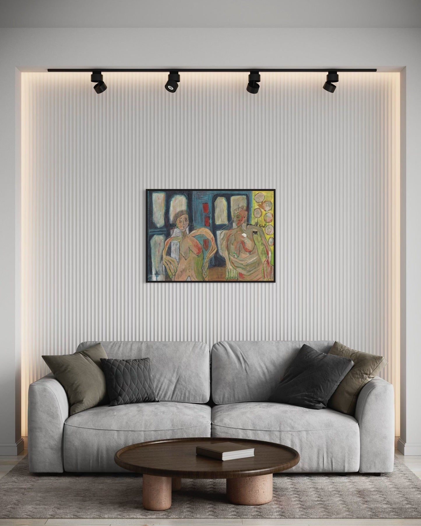 Gray sofa in a living room with a colorful painting on the wall.