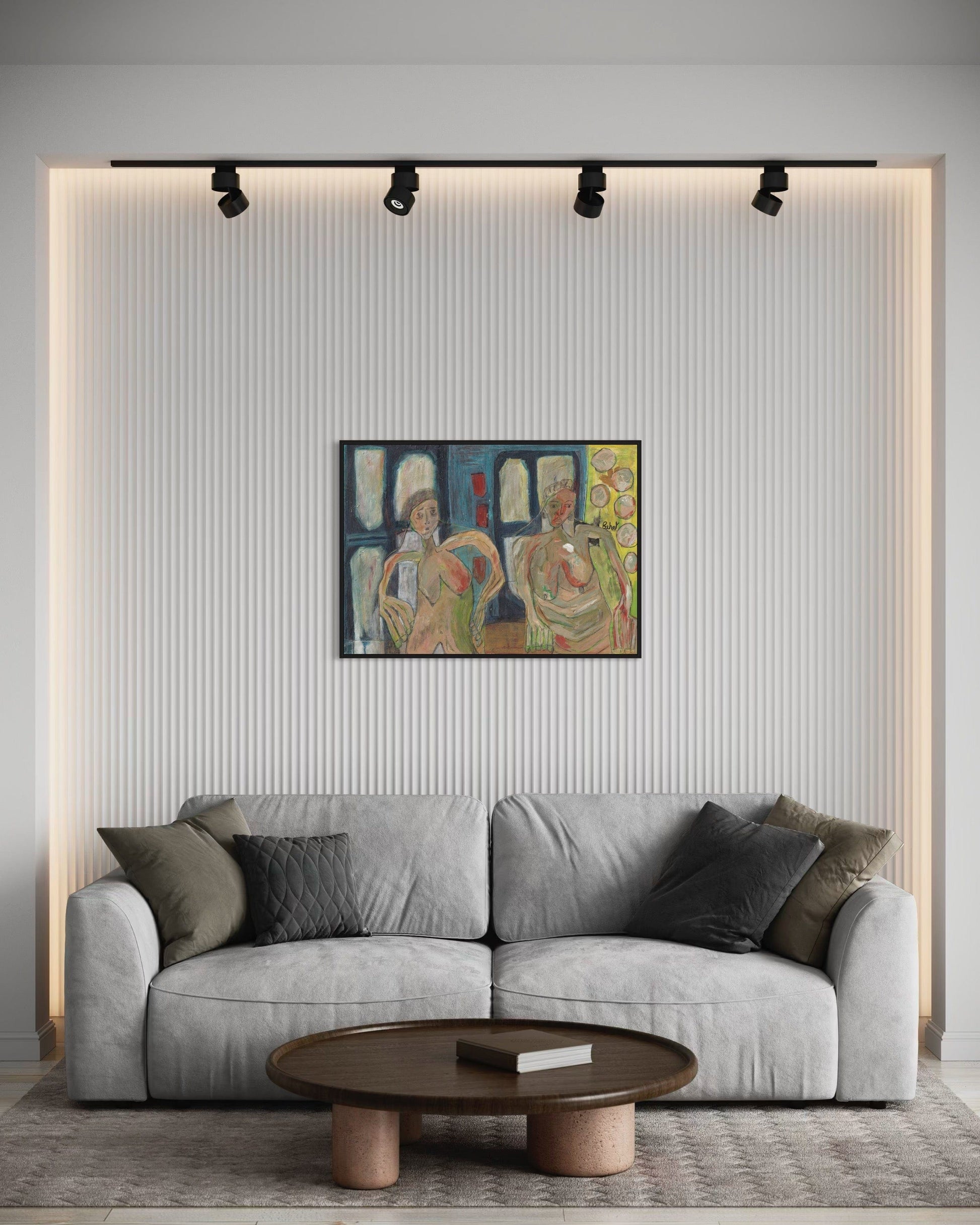 Gray sofa in a living room with a colorful painting on the wall.