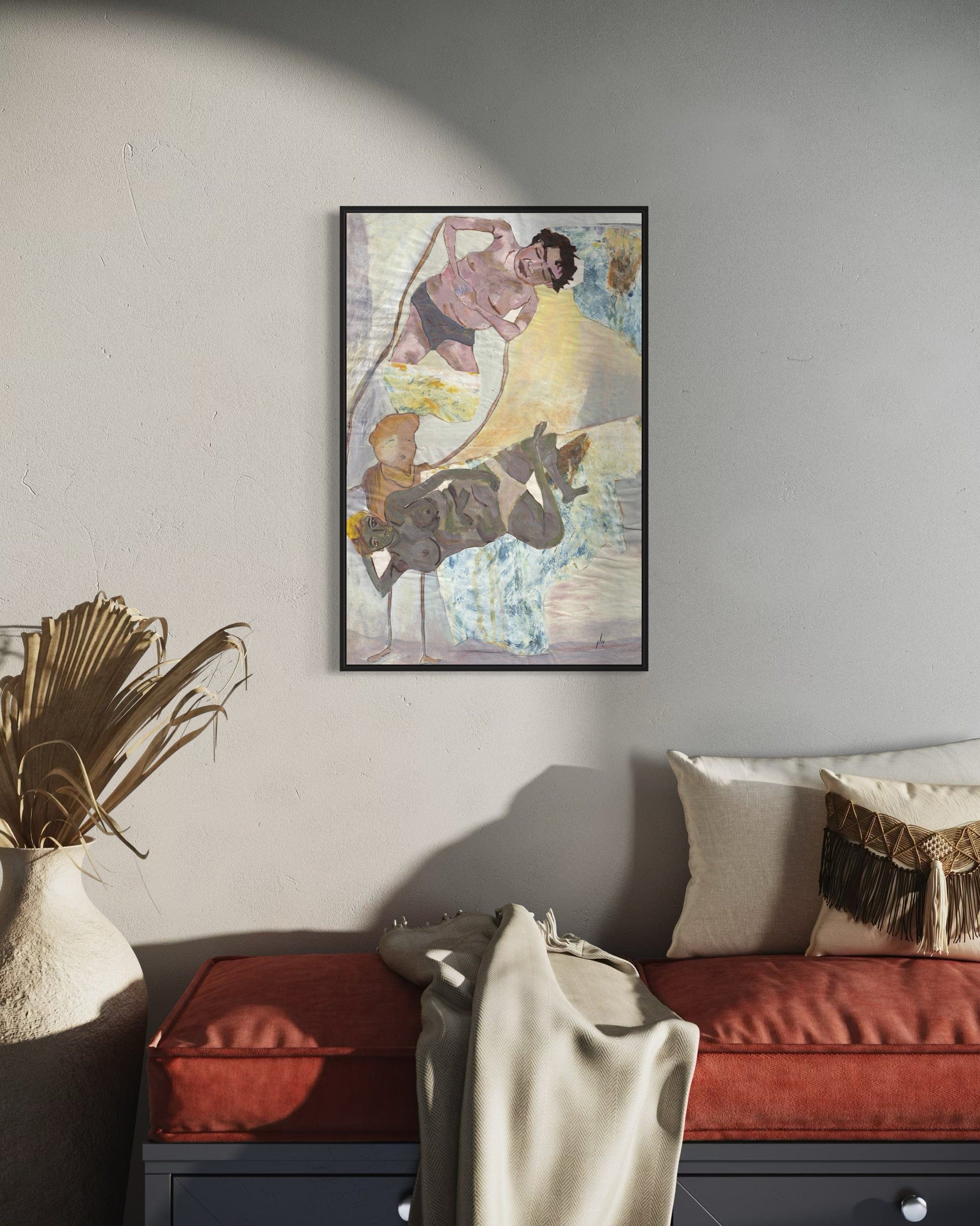 Framed abstract art piece on a wall above a sofa in a living room.